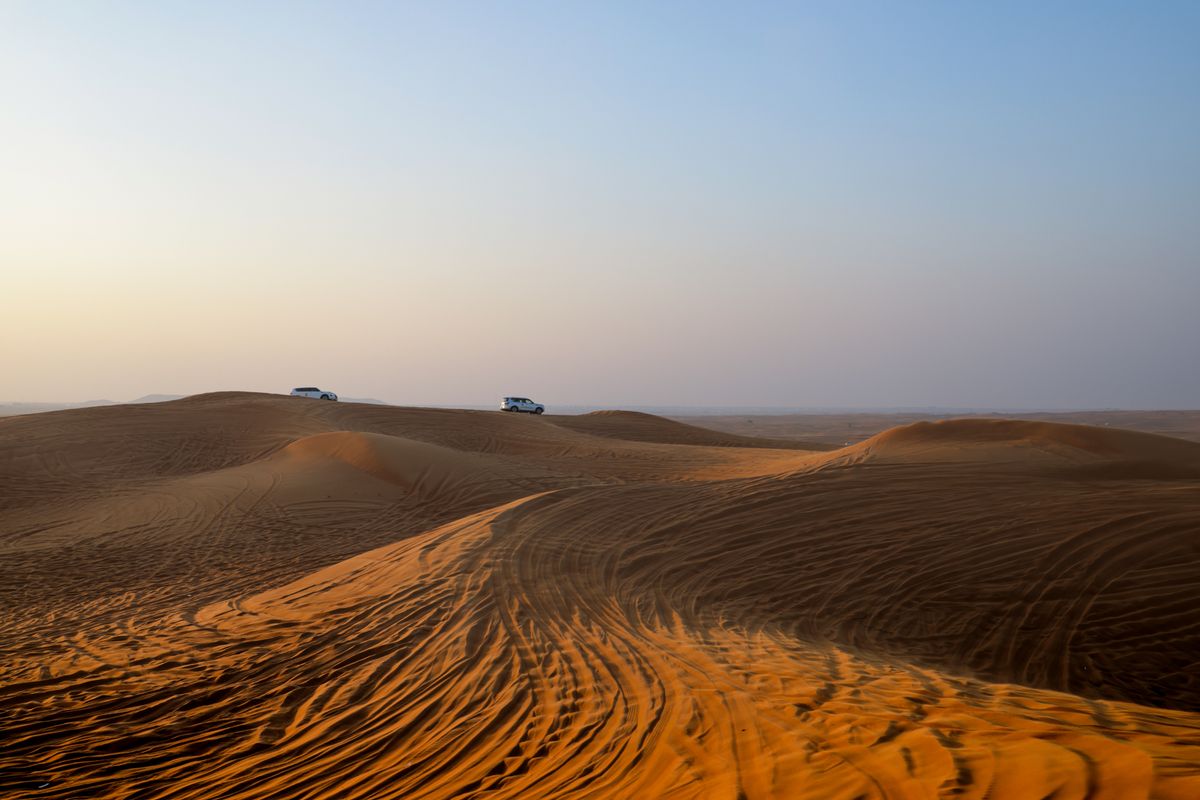 4x4 jeep crossing the desert dunes near Hurghada, Egypt at dusk