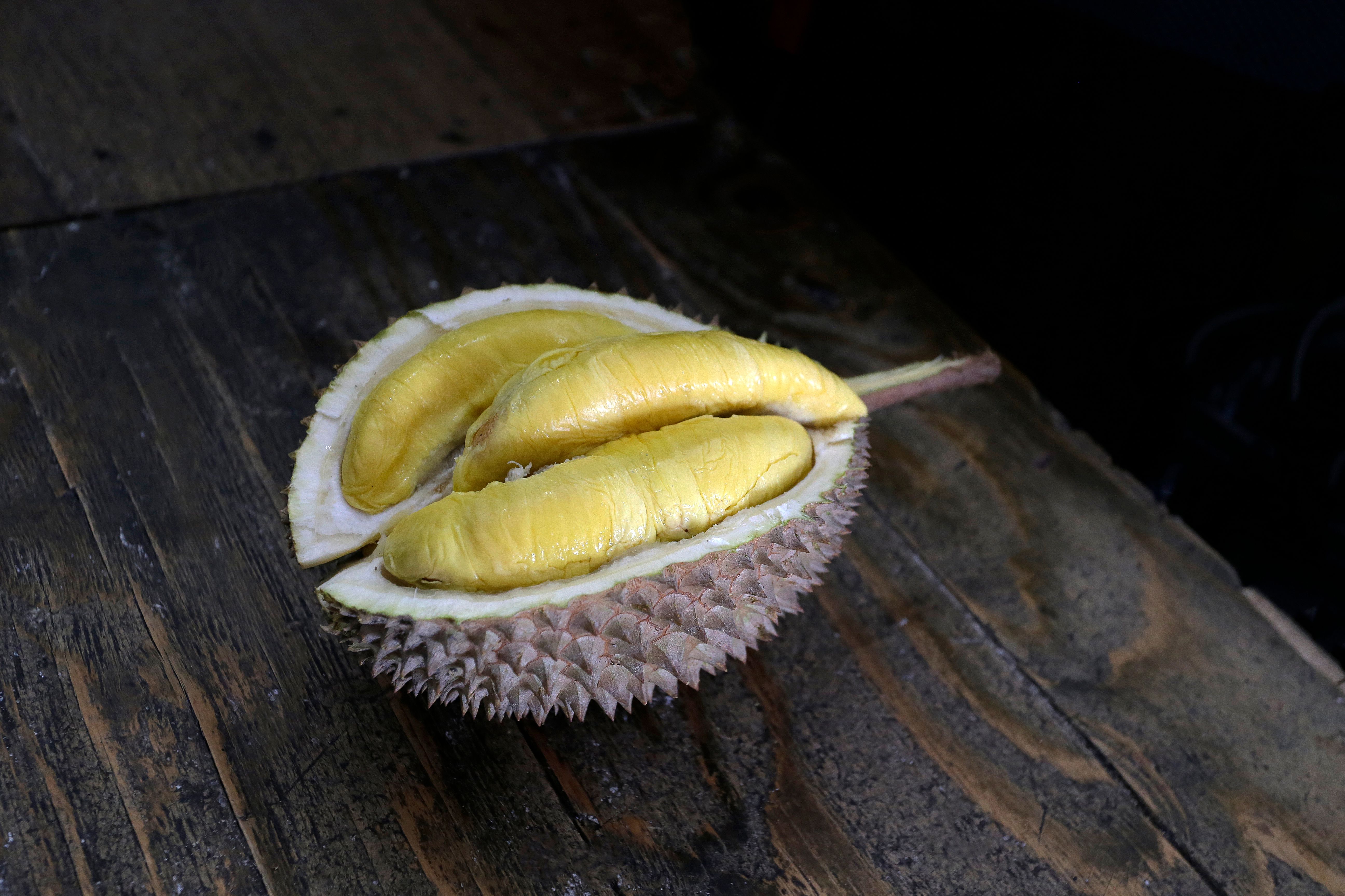 Close-up of Durian Fruit on Wooden Surface · Free Stock Photo