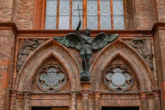 Gothic architectural details with religious statue in Berlin, Germany.