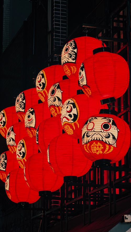 Free A stunning display of red lanterns featuring Daruma art in vibrant Osaka nightlife. Stock Photo