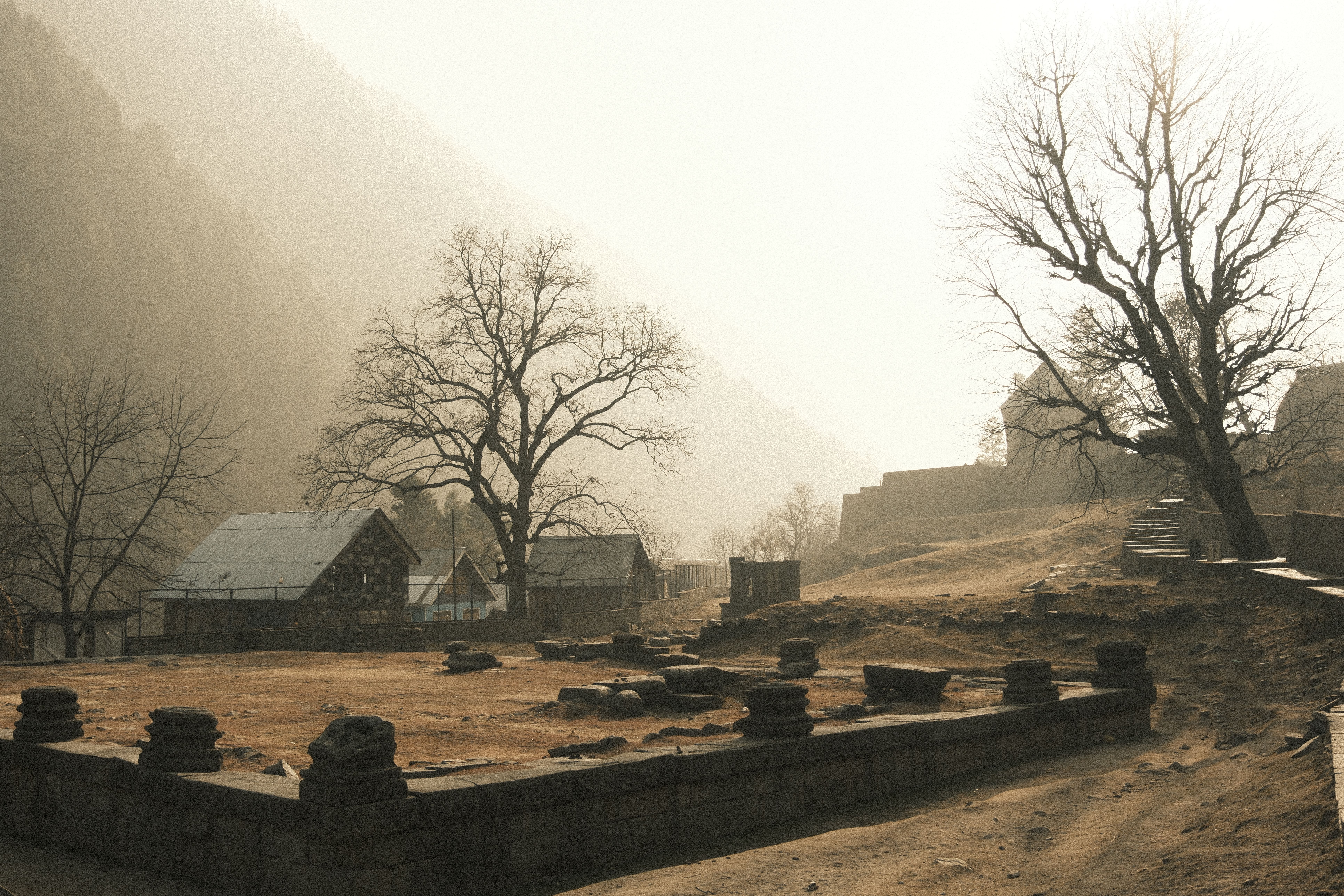 Misty Mountain Village in Early Morning Light · Free Stock Photo