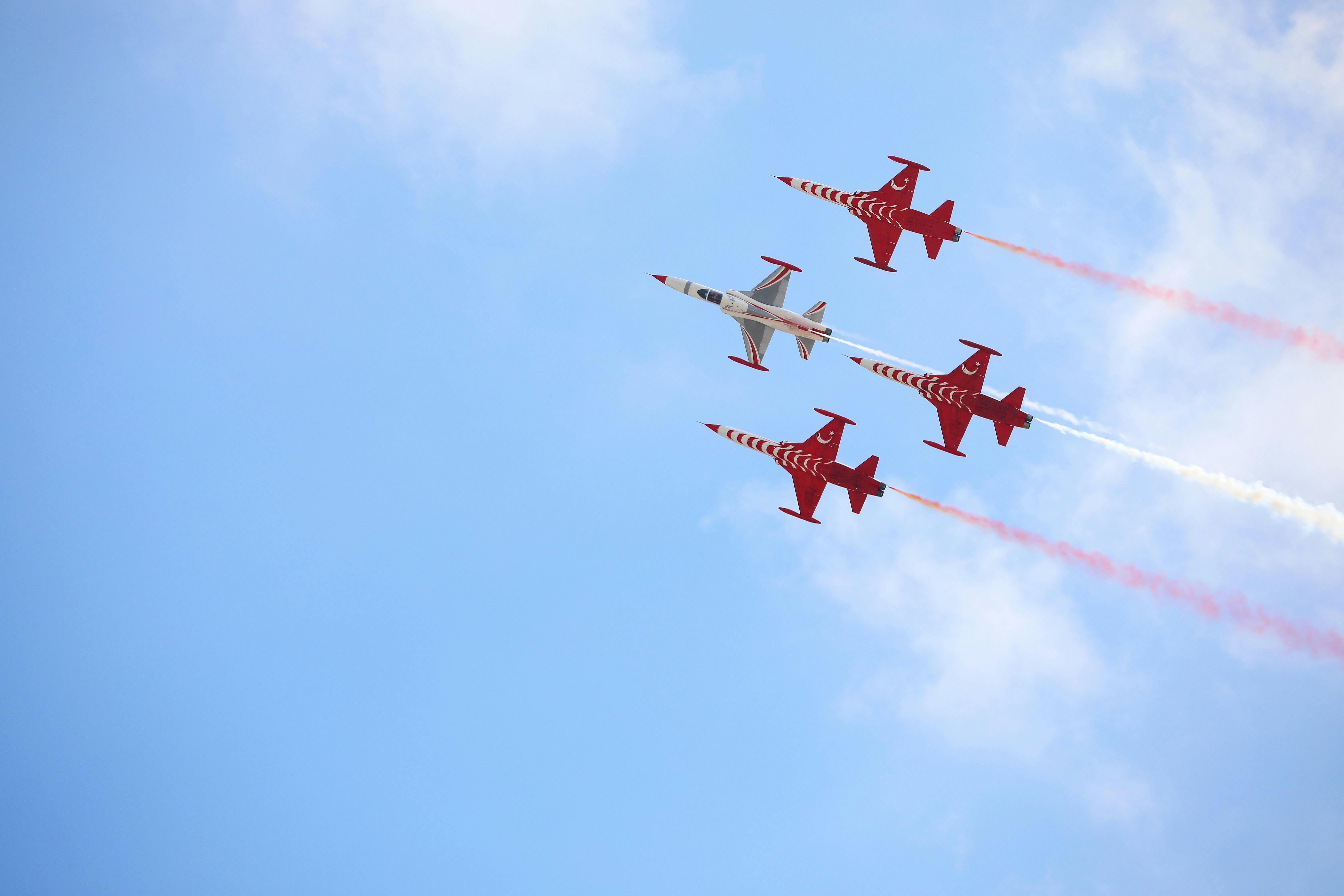 The Turkish Stars perform an impressive aerial display in the clear blue sky.