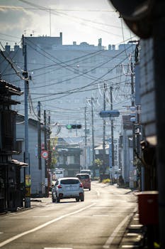 A serene city street in the morning light, highlighting urban life and architecture.