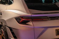 Sleek Luxury Car Rear Design in Showroom Setting