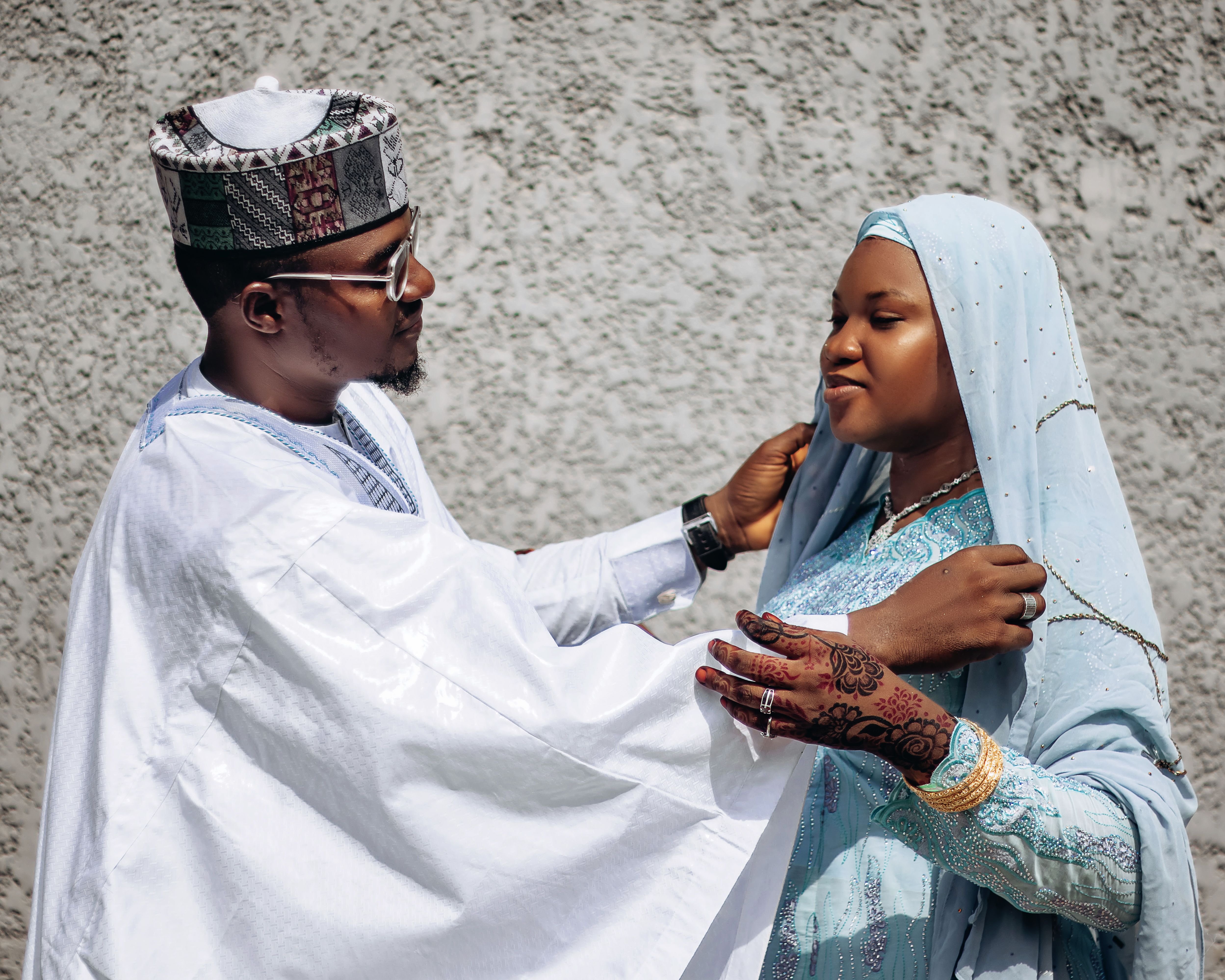 Couple Embracing in Traditional Attire Portrait · Free Stock Photo