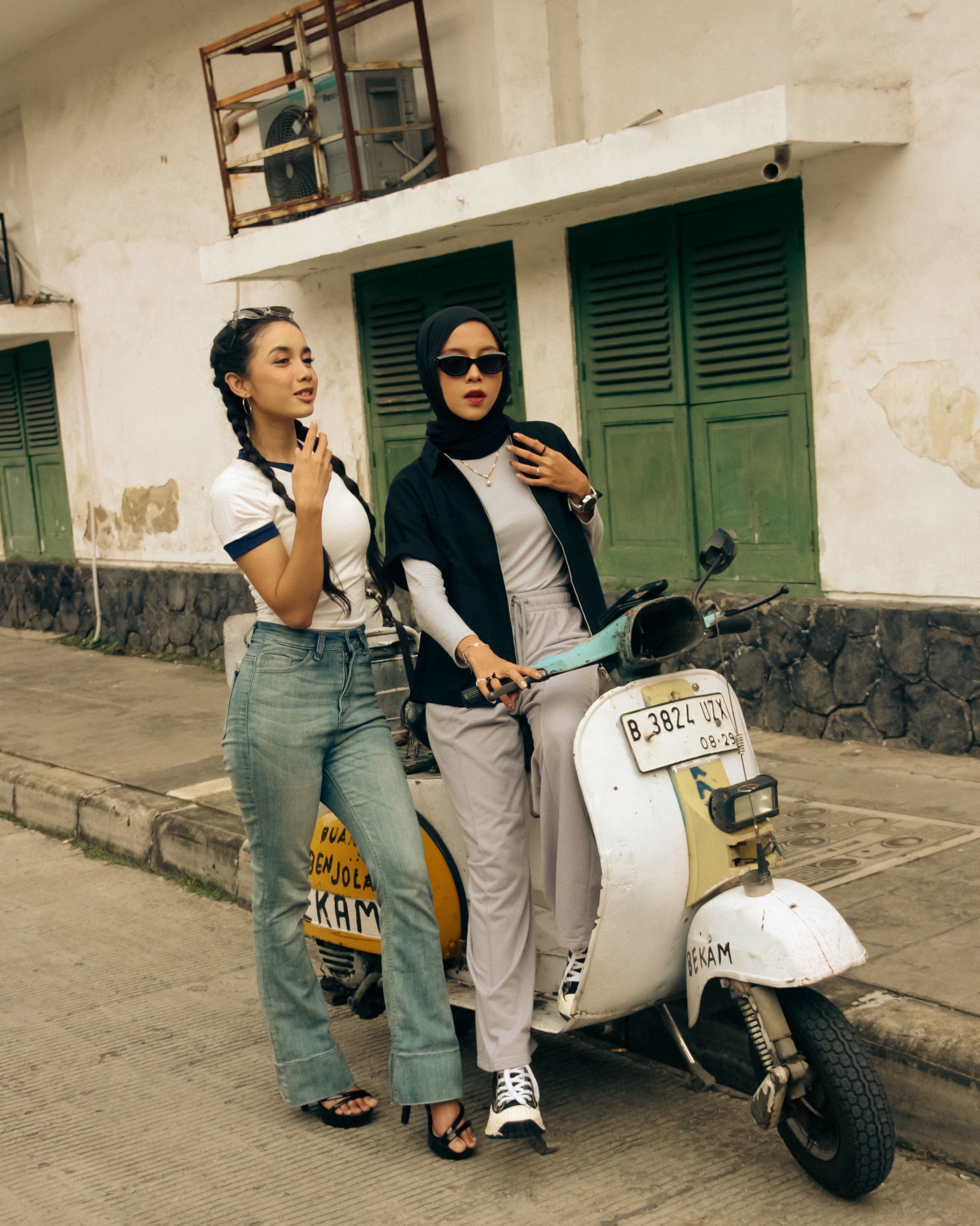 Casual Urban Street Scene with Two Women and Scooter