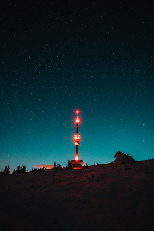 Free Illuminated tower under a starry sky in Malá Morávka, Czechia, showcasing a stunning night landscape. Stock Photo