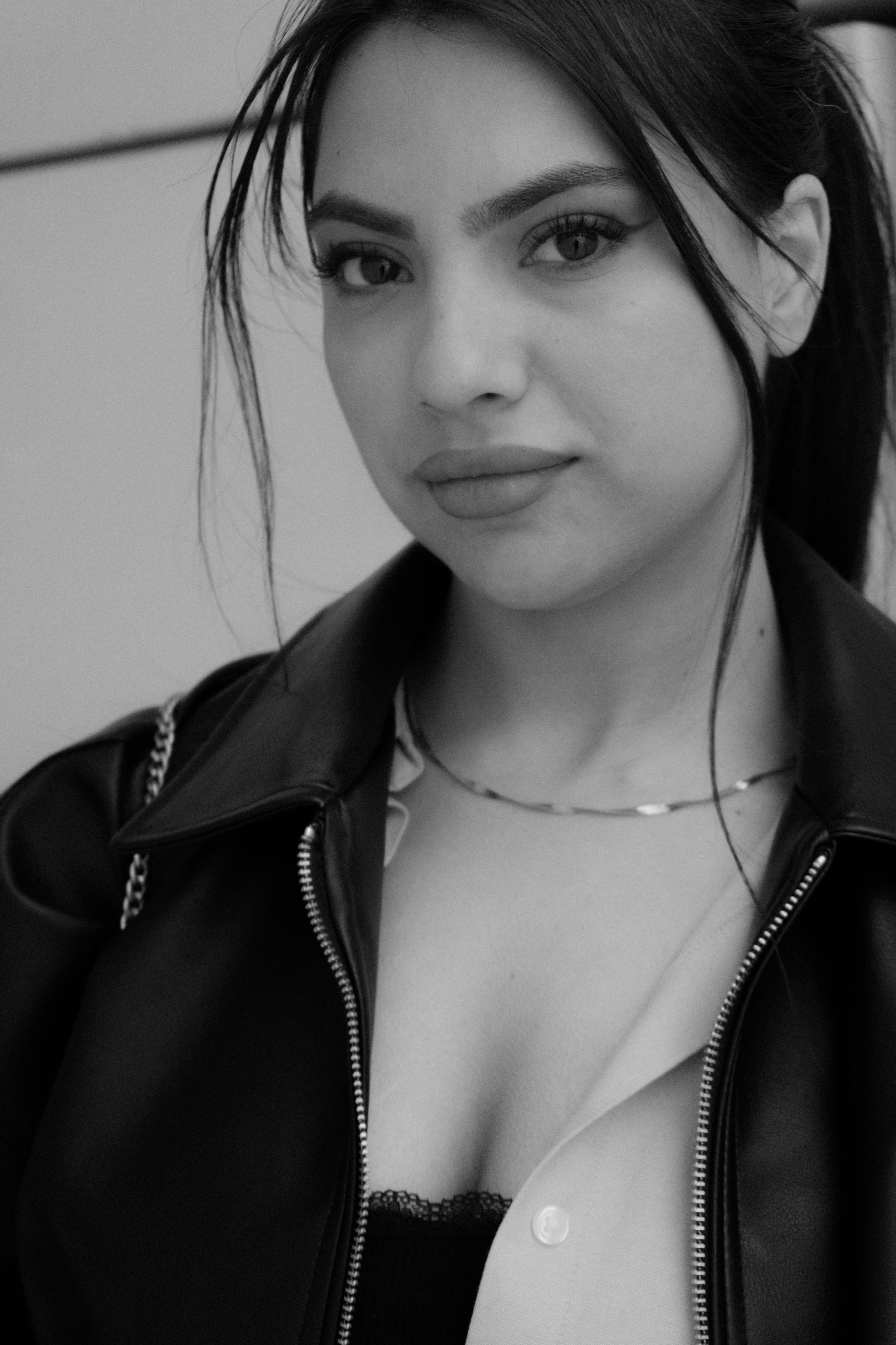 Black and White Portrait of a Woman in Leather Jacket · Free Stock Photo