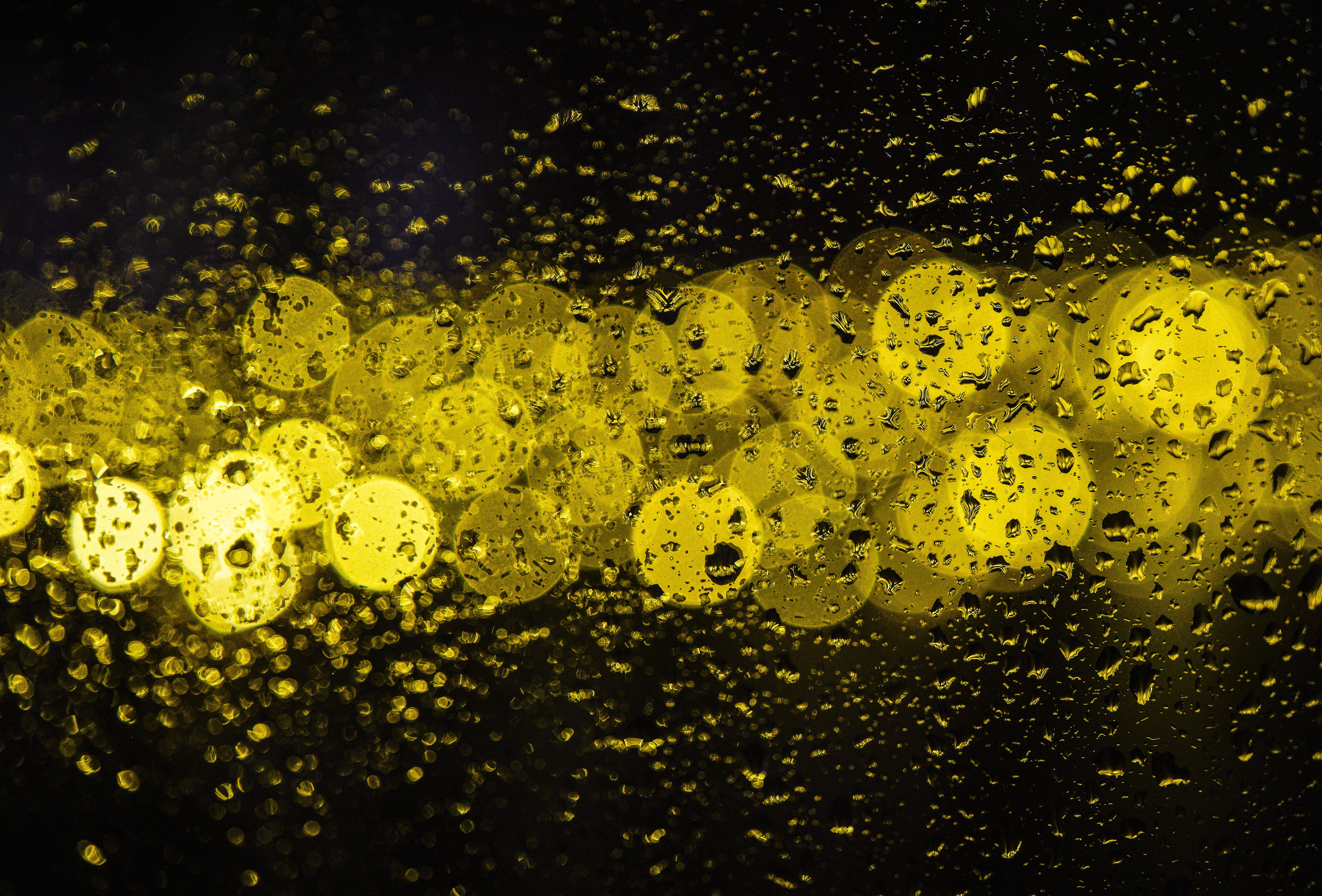 Abstract Raindrops on Glass with Bokeh Lights · Free Stock Photo