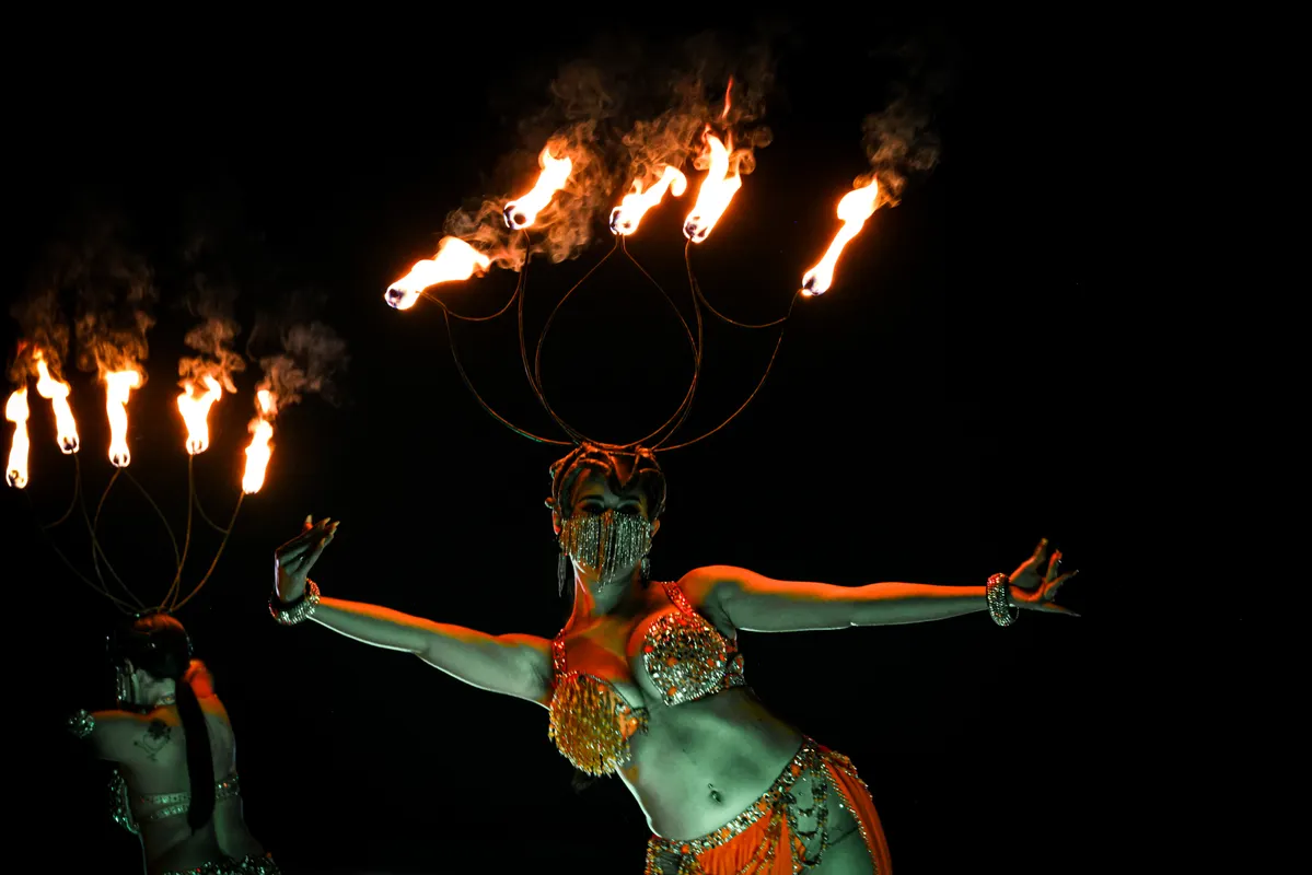 Fire-knife dancers performing a high-energy luau show on Oahu