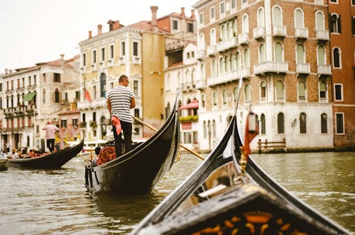 Free Photo Of Man Standing On Boat Stock Photo