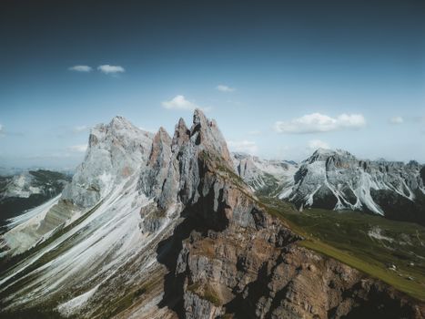 Stunning aerial view of the rugged Seceda mountain peaks in the Dolomites, Italy.