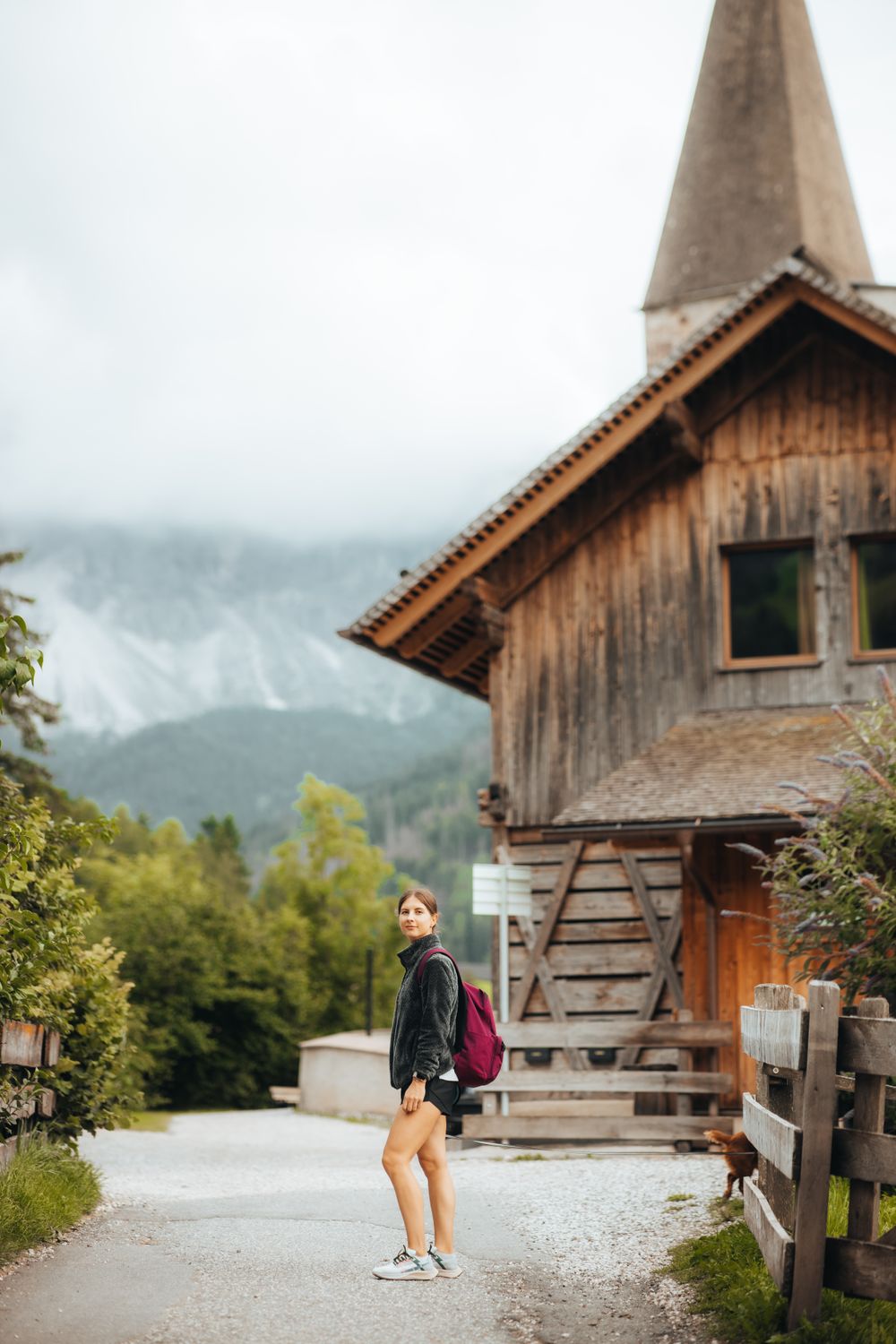 Rustic Backpacking Look Young Woman Hiking by Rustic Mountain Cabin · Free Stock Photo
