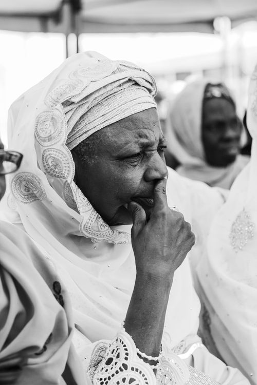 Free Black and white portrait of pensive senior woman in traditional clothing showing deep thought. Stock Photo