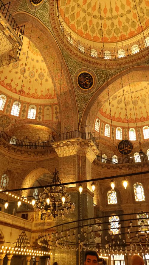 Free Intricate details of a mosque's dome illuminated by warm lighting, showcasing Islamic architecture. Stock Photo