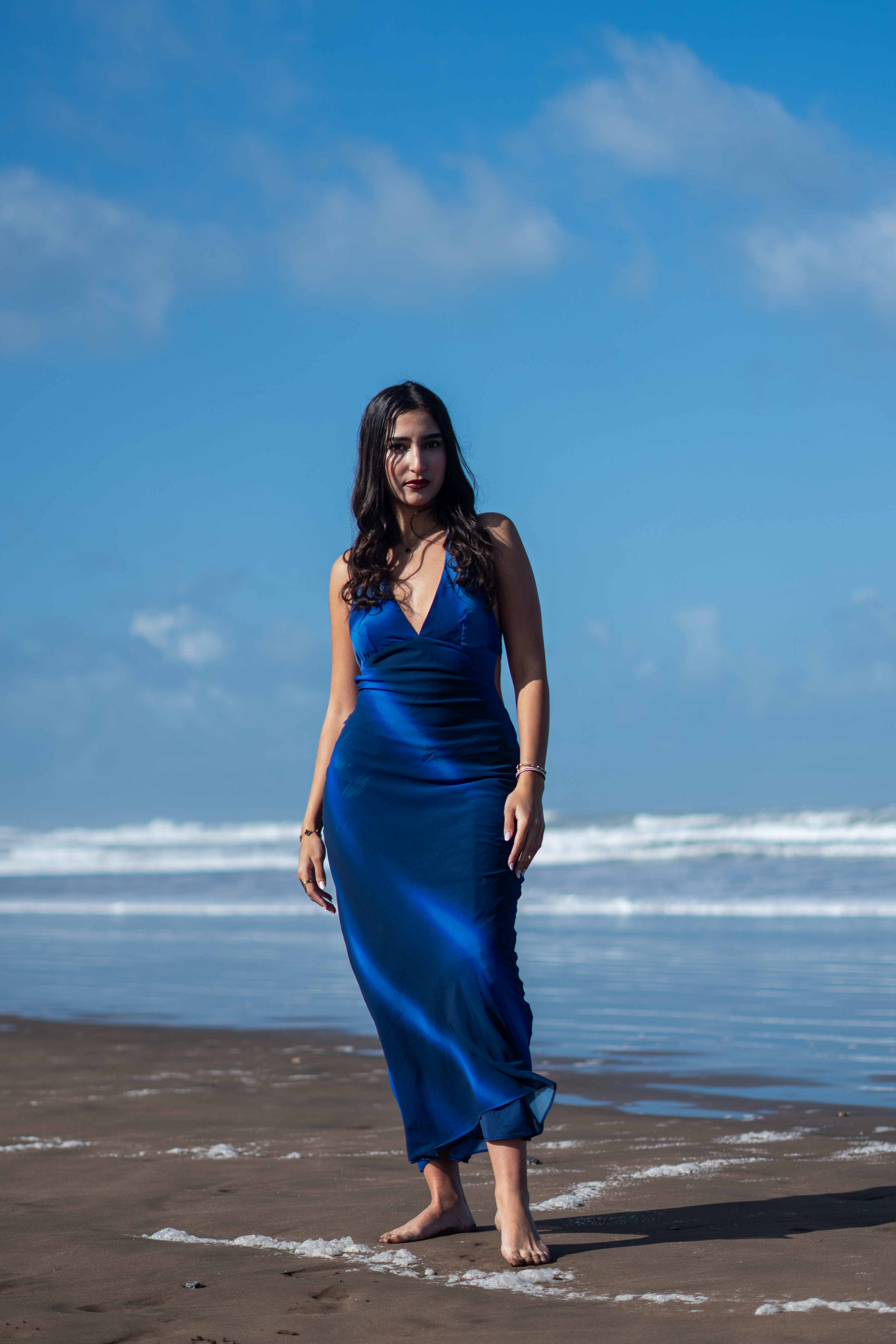 Woman in Blue Dress Strolling on Moroccan Beach · Free Stock Photo