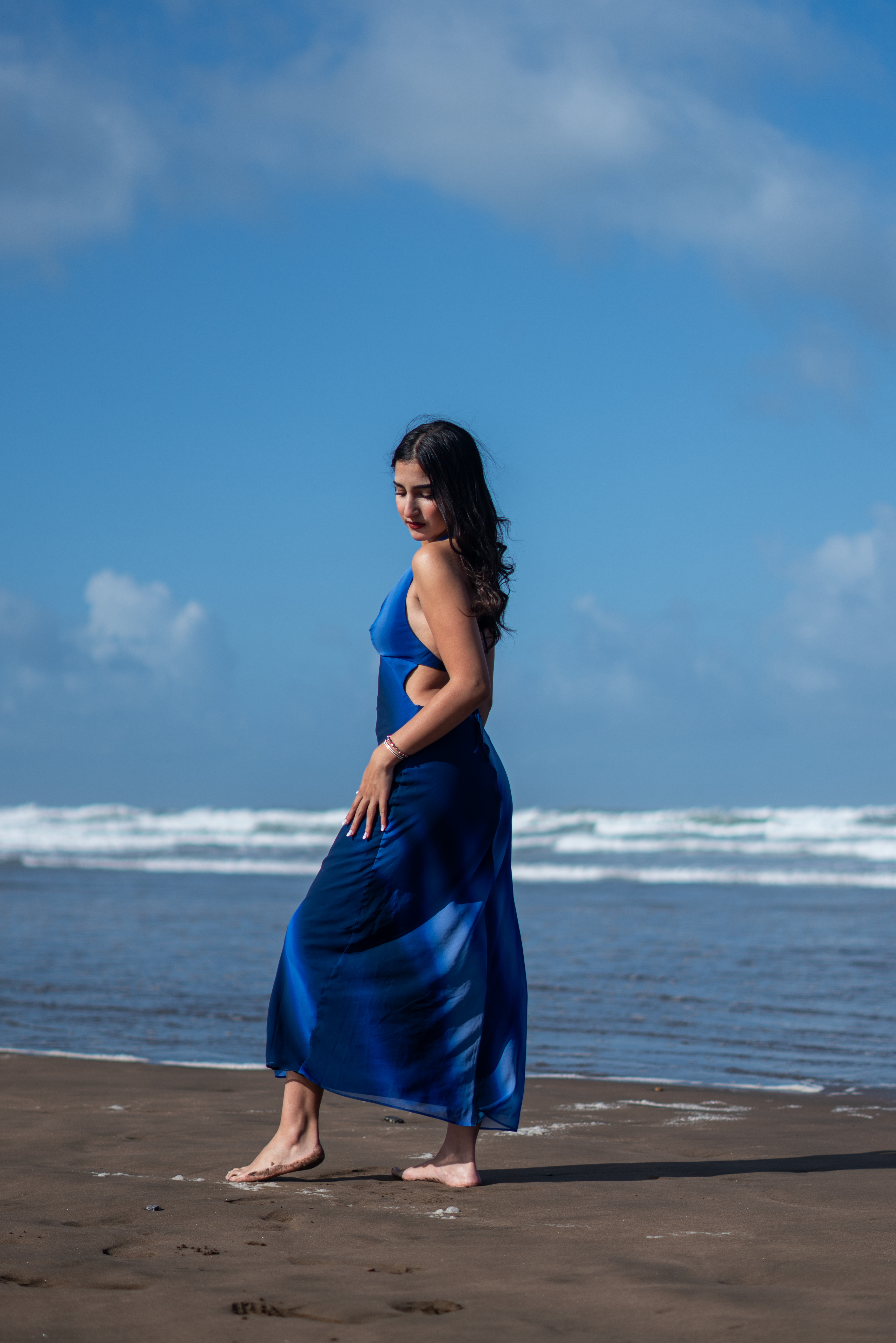 Woman in Blue Dress Walking on Moroccan Beach · Free Stock Photo