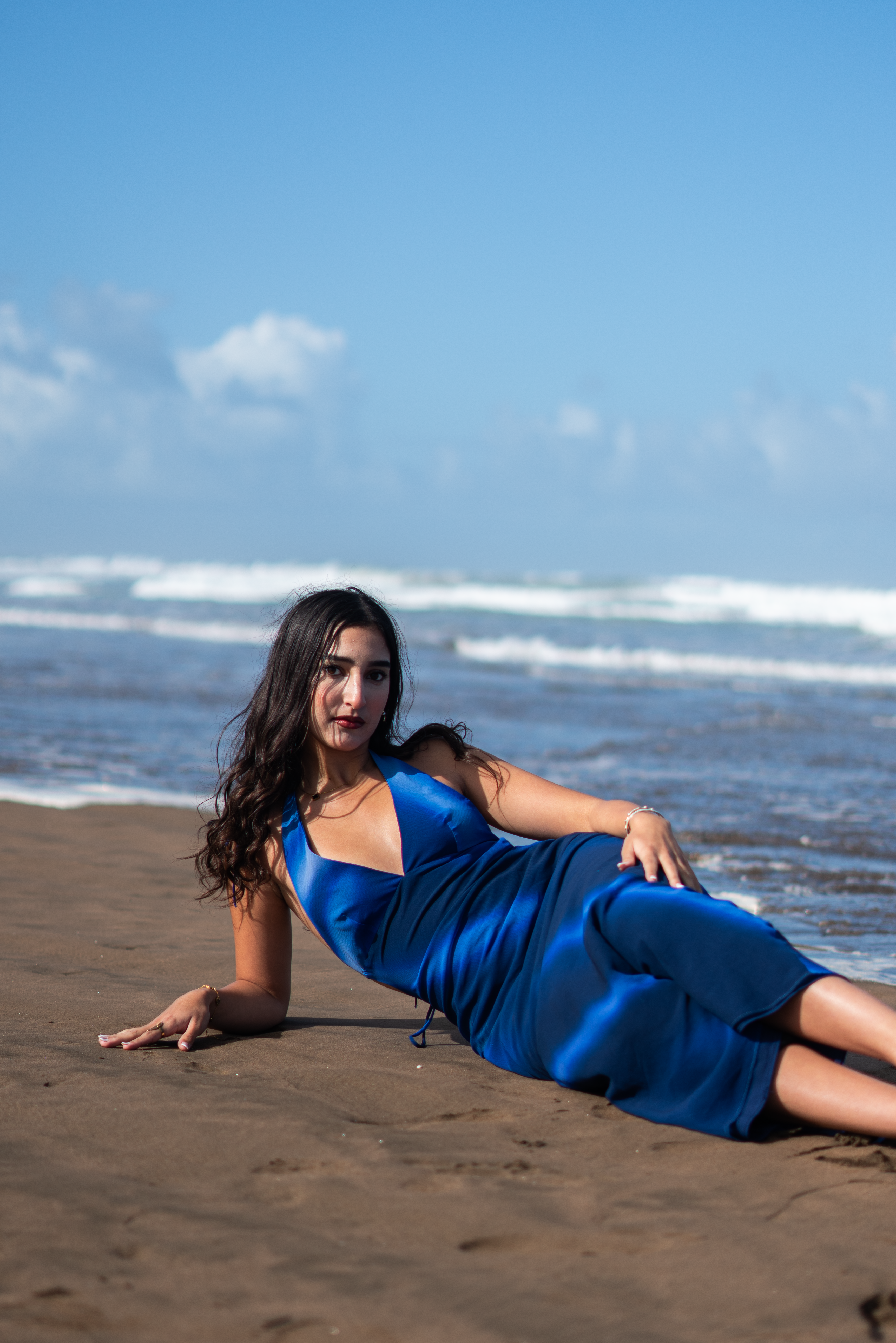 Elegant Woman in Blue Dress on Moroccan Beach · Free Stock Photo