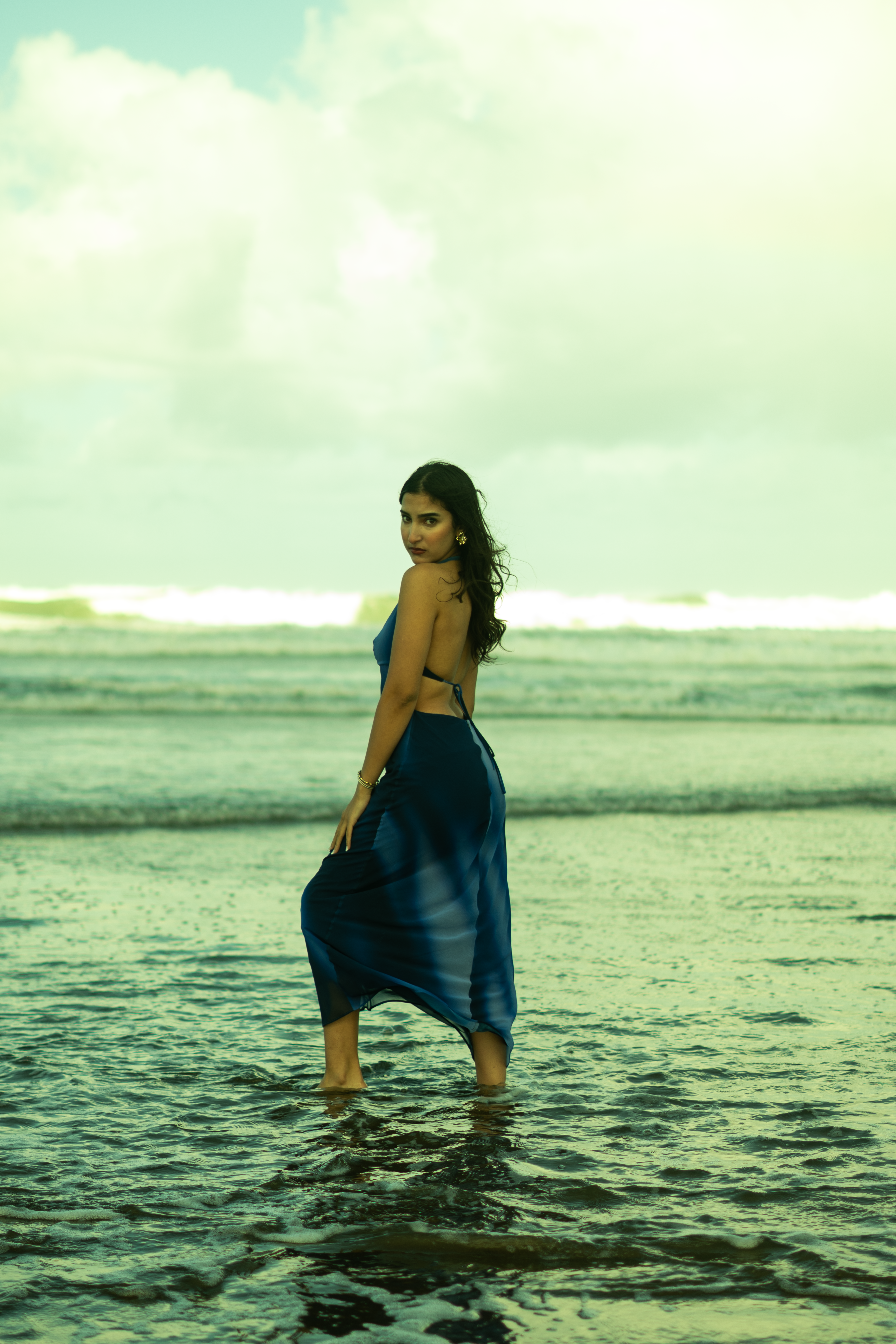 Woman in Blue Dress Poses at Moroccan Beach · Free Stock Photo