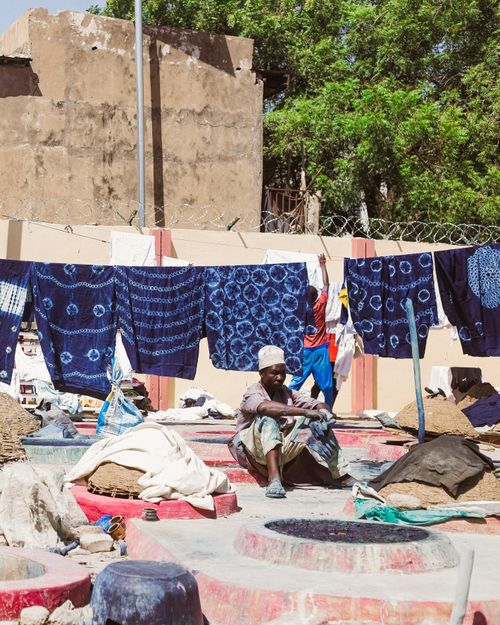 Free Colorful traditional fabric dyeing scene in Kano, Nigeria, showcasing local craftsmanship. Stock Photo