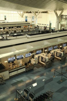 Aerial view of the check-in counters at Haneda Airport, Tokyo, showcasing modern architecture.