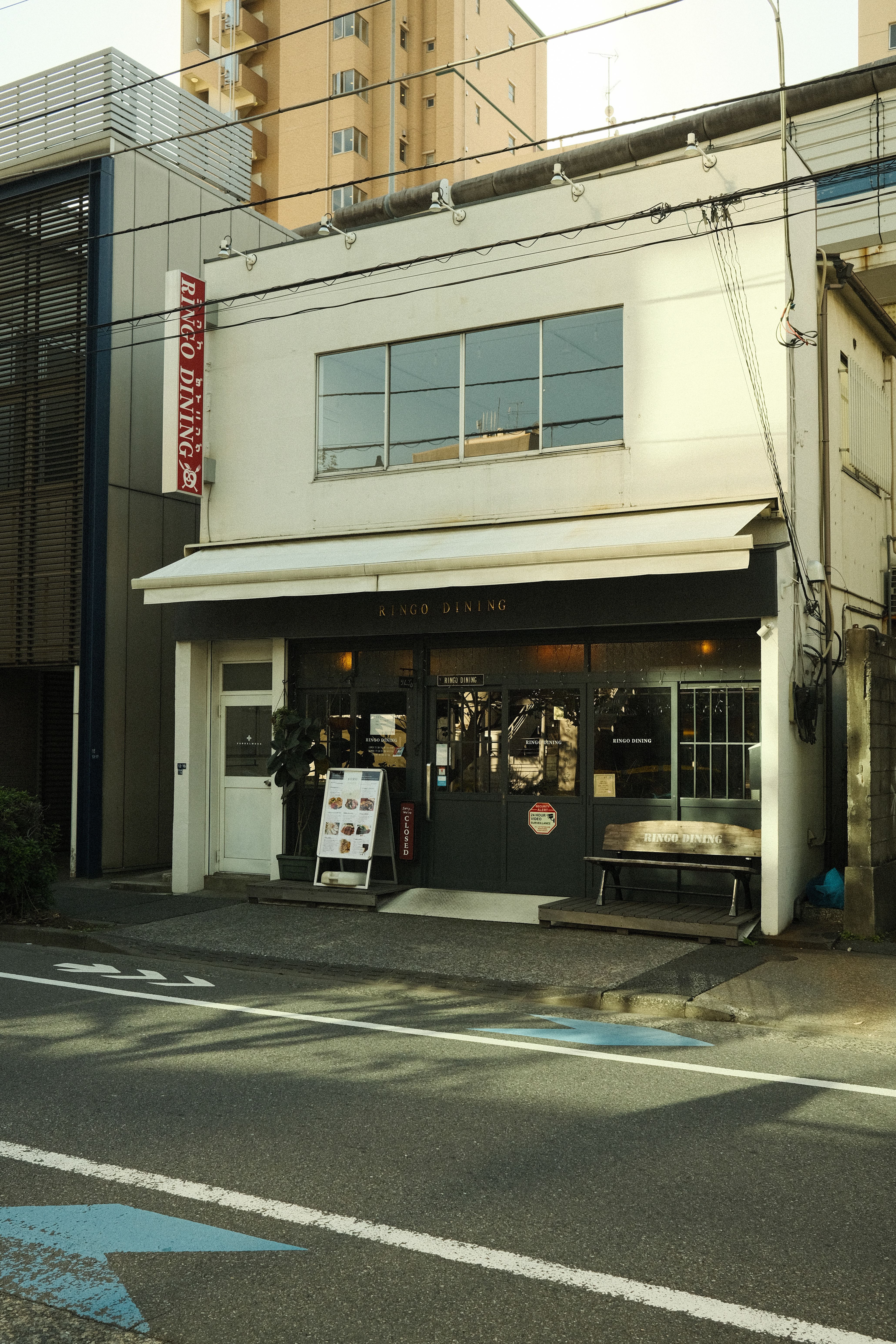 View of a quaint street cafe in an urban setting, perfect for dining experiences.