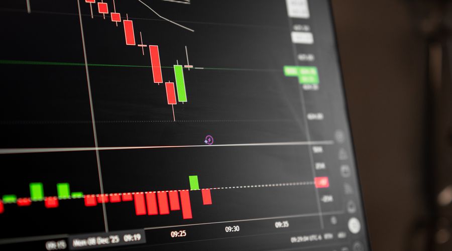 Close-up of digital trading screen displaying candlestick chart data showing price patterns and market trends