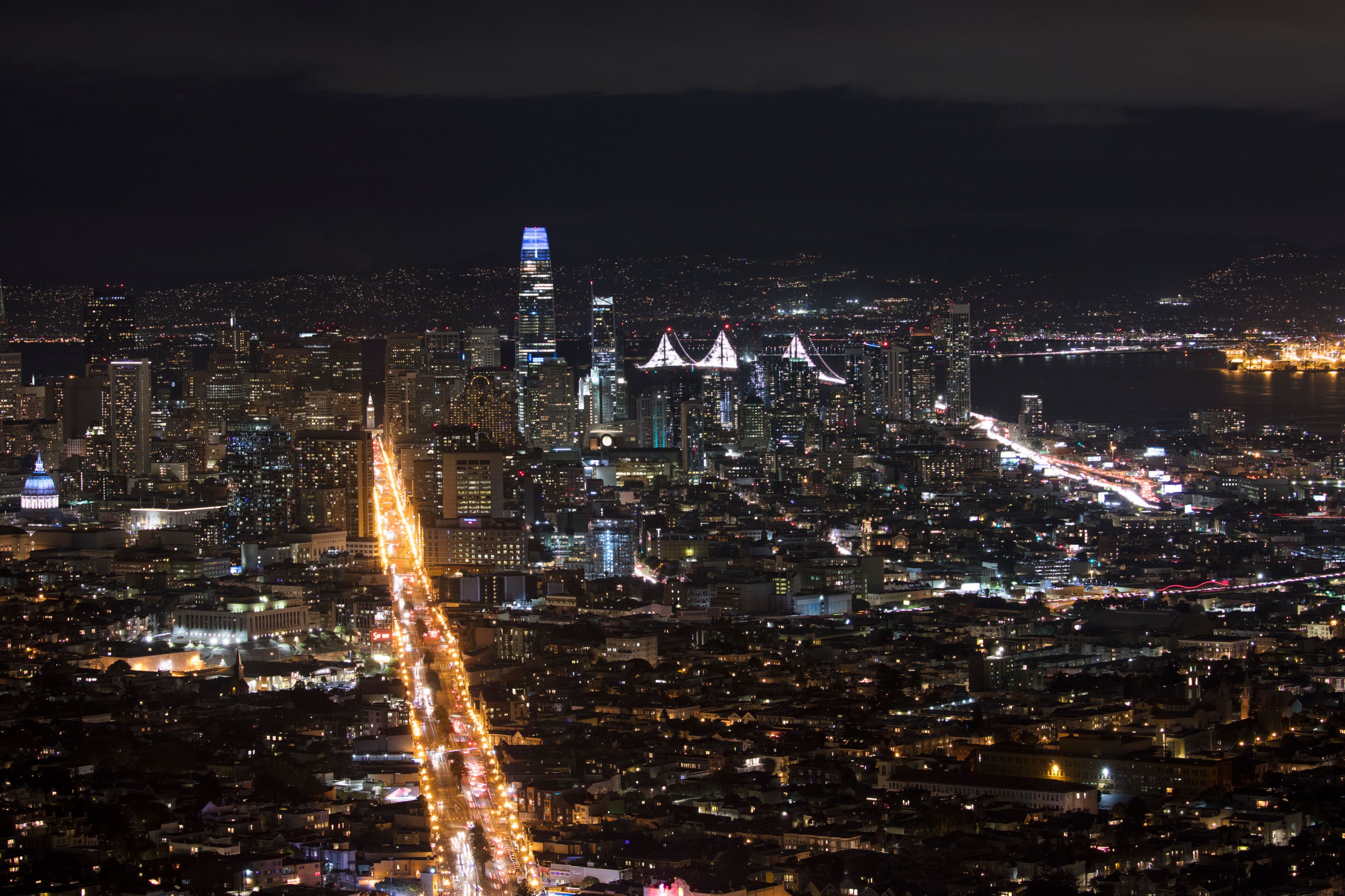 Breathtaking aerial view of San Francisco's illuminated skyline with iconic landmarks and city lights.