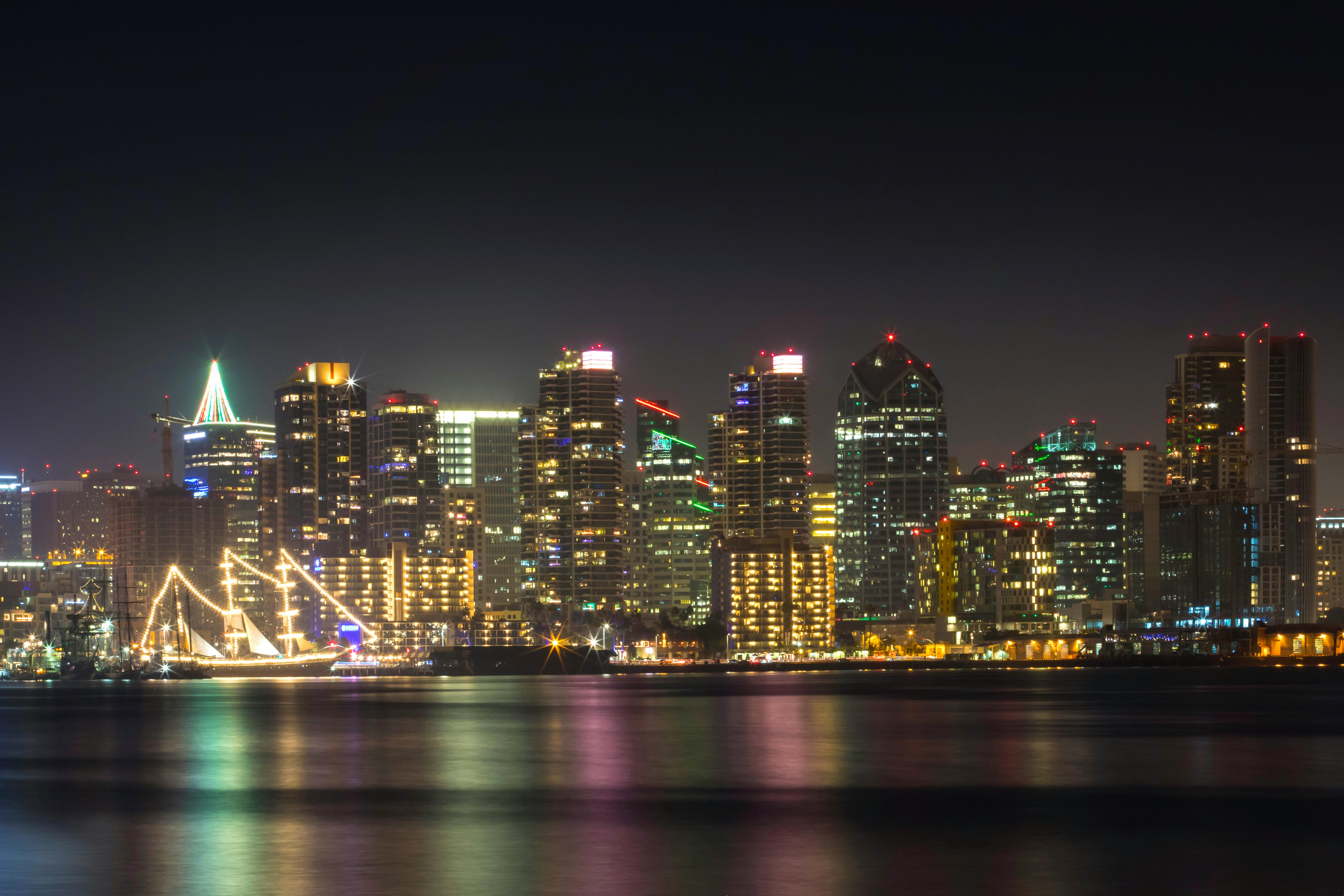 Stunning view of San Diego's illuminated skyline reflecting on the water at night.