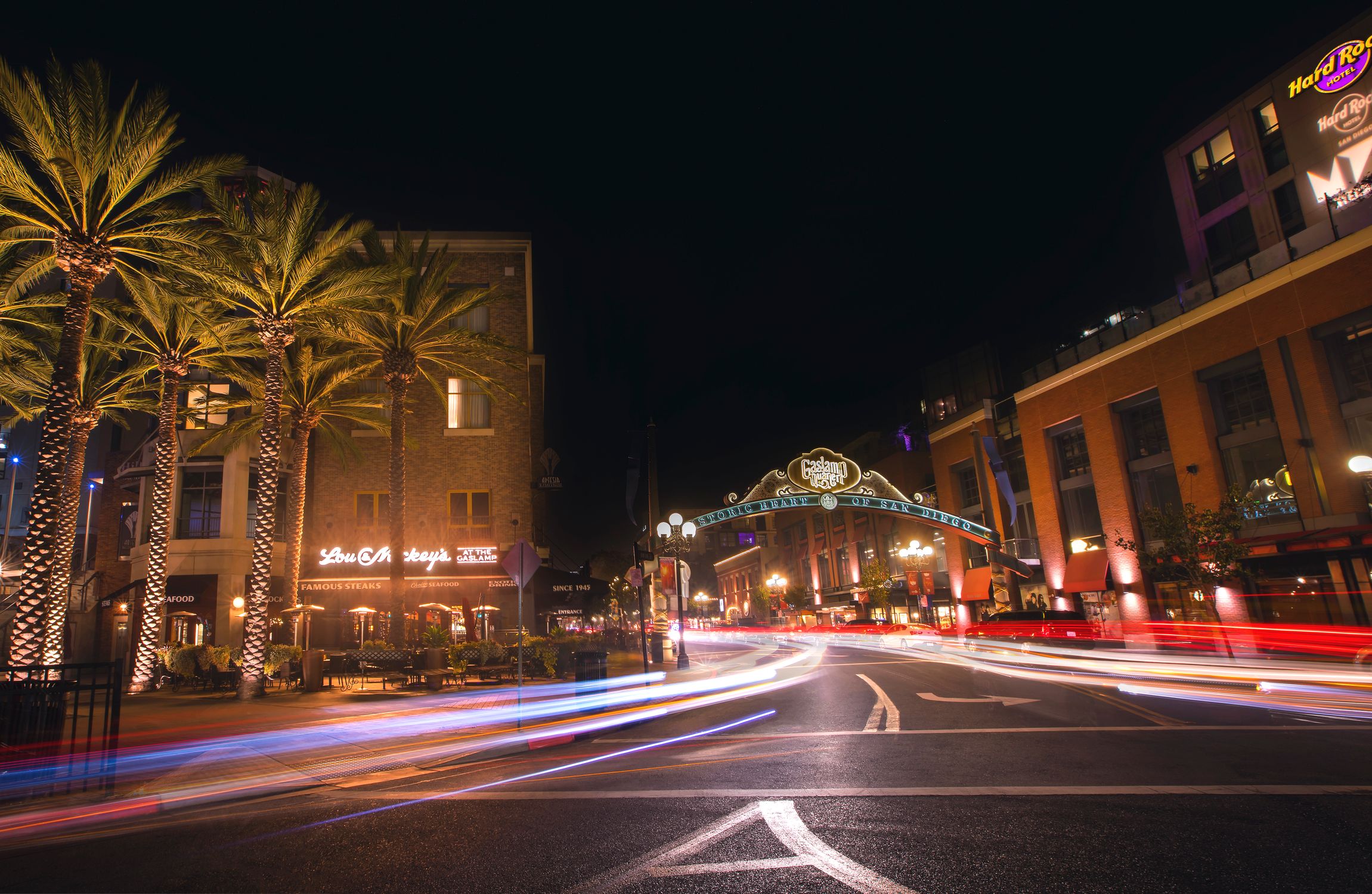 Explore the lively nightlife of San Diego's Gaslamp Quarter, captured through vibrant light trails.