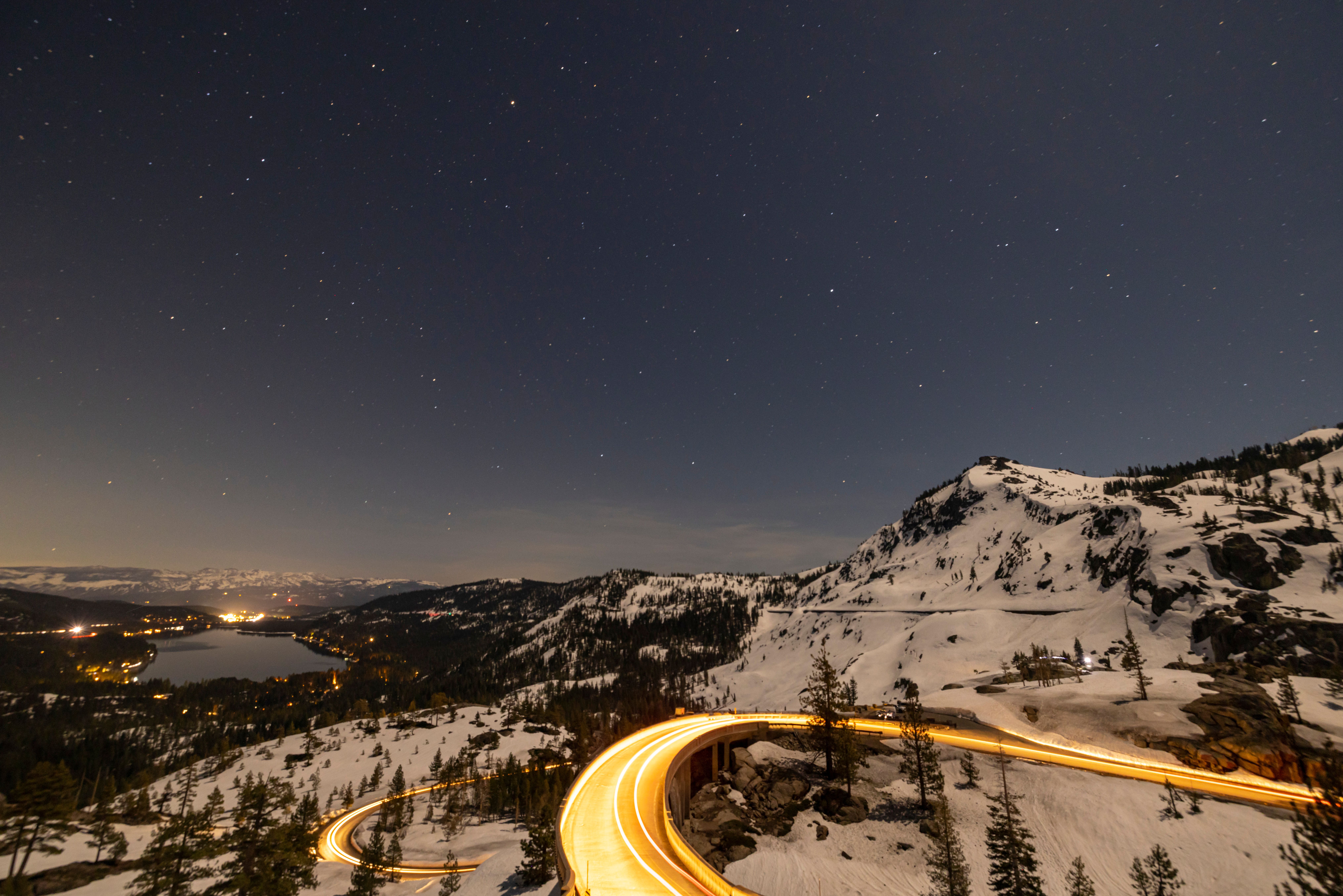 Starry Night Over Snowy Mountain Pass · Free Stock Photo