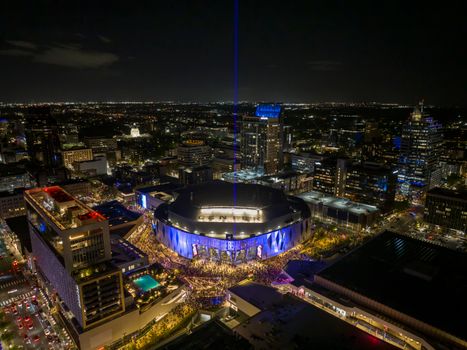 Aerial view of the illuminated Golden 1 Center arena at night in downtown Sacramento, California.