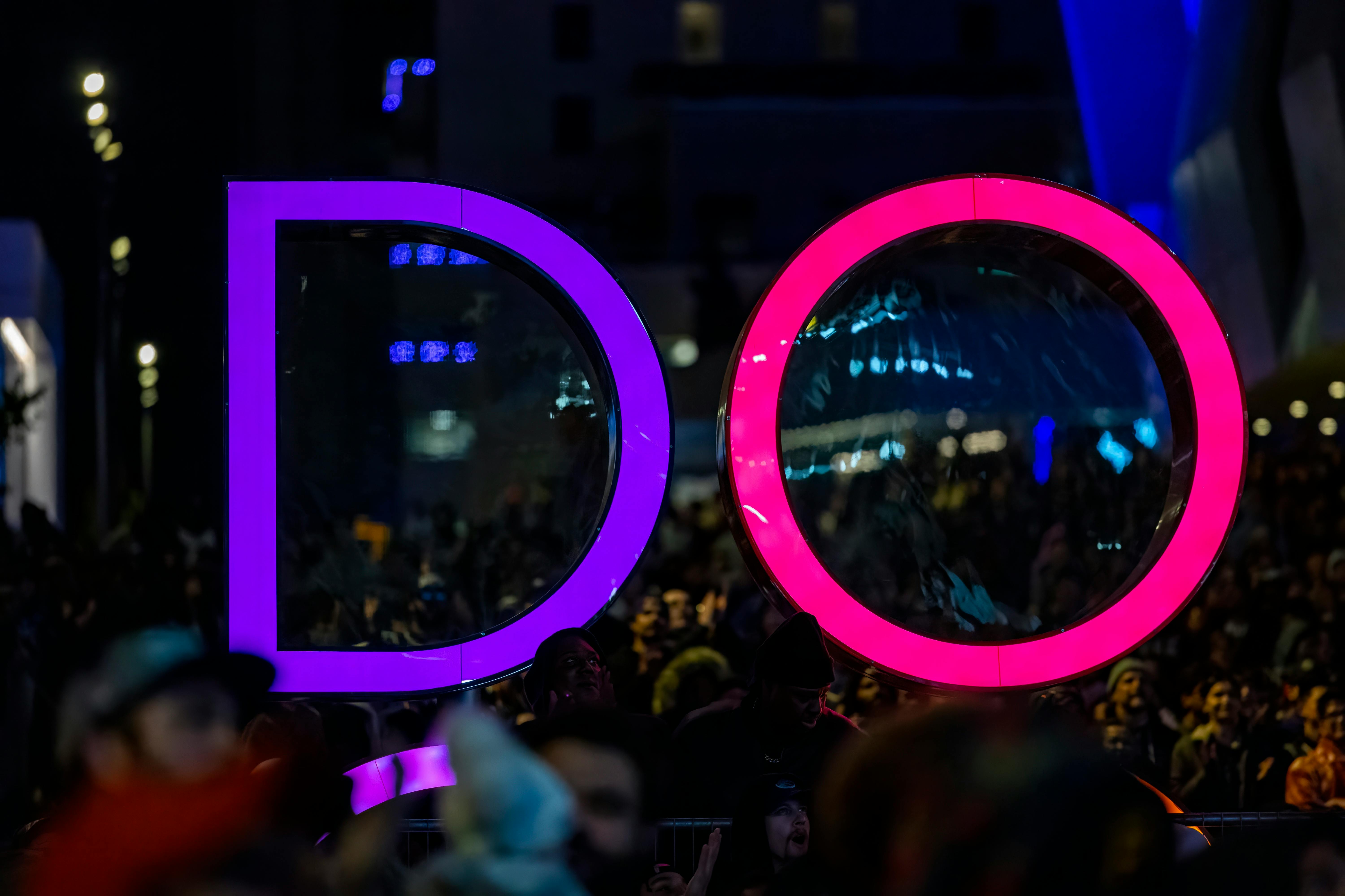 Nightclub crowd under purple neon lights