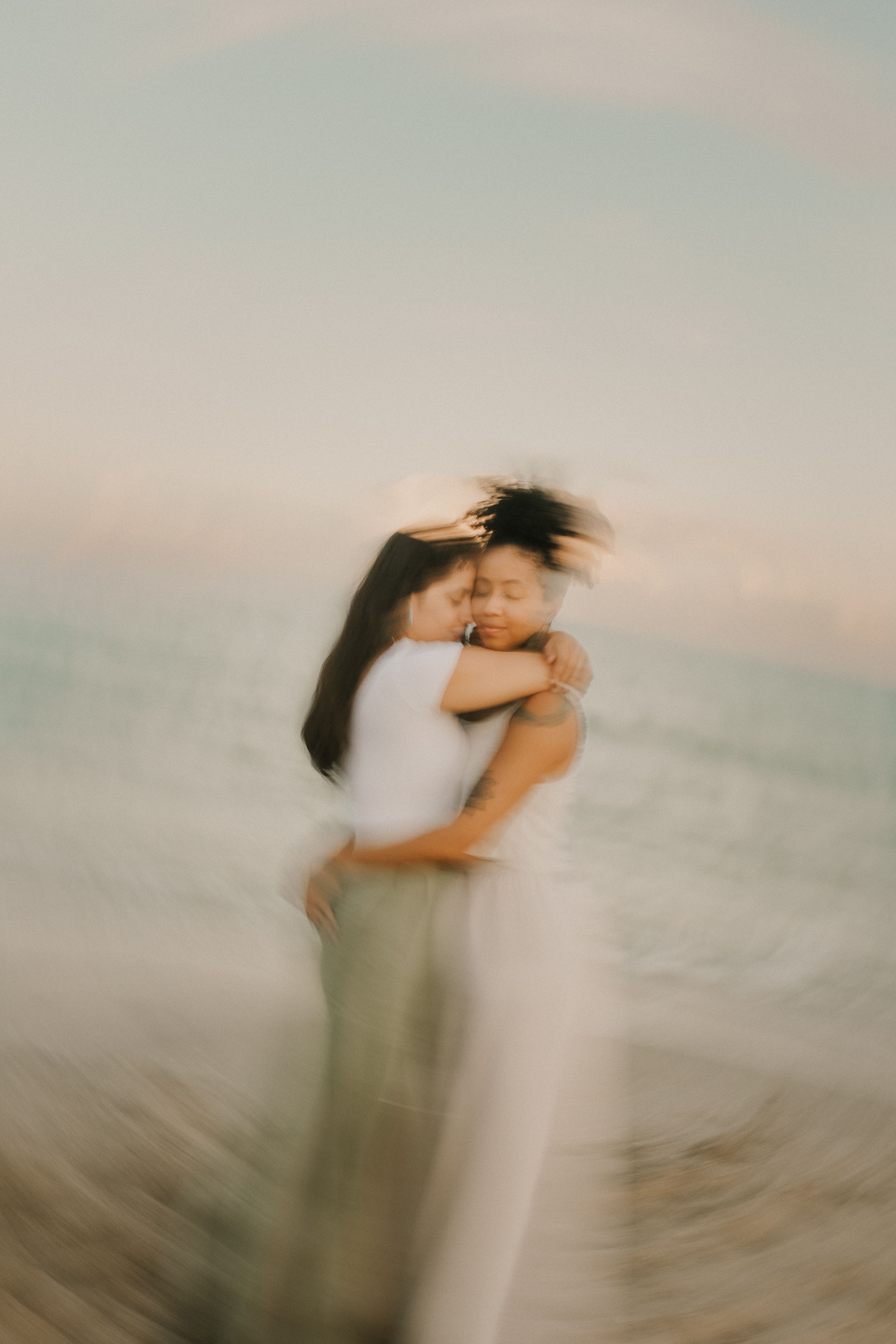Romantic Couple Embracing at Sunset Beach · Free Stock Photo