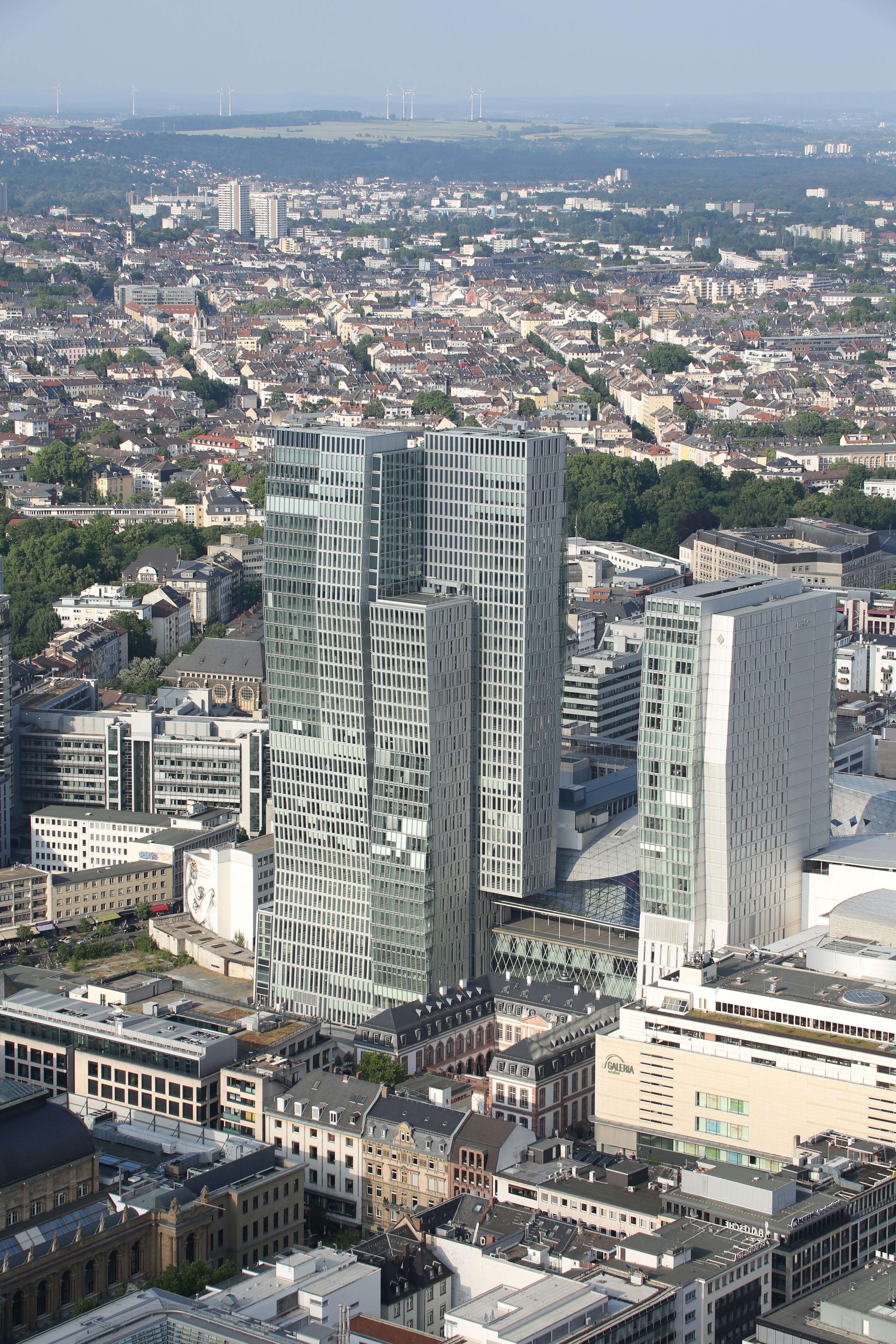 Stunning aerial capture of modern skyscrapers in Frankfurt with a cityscape background.