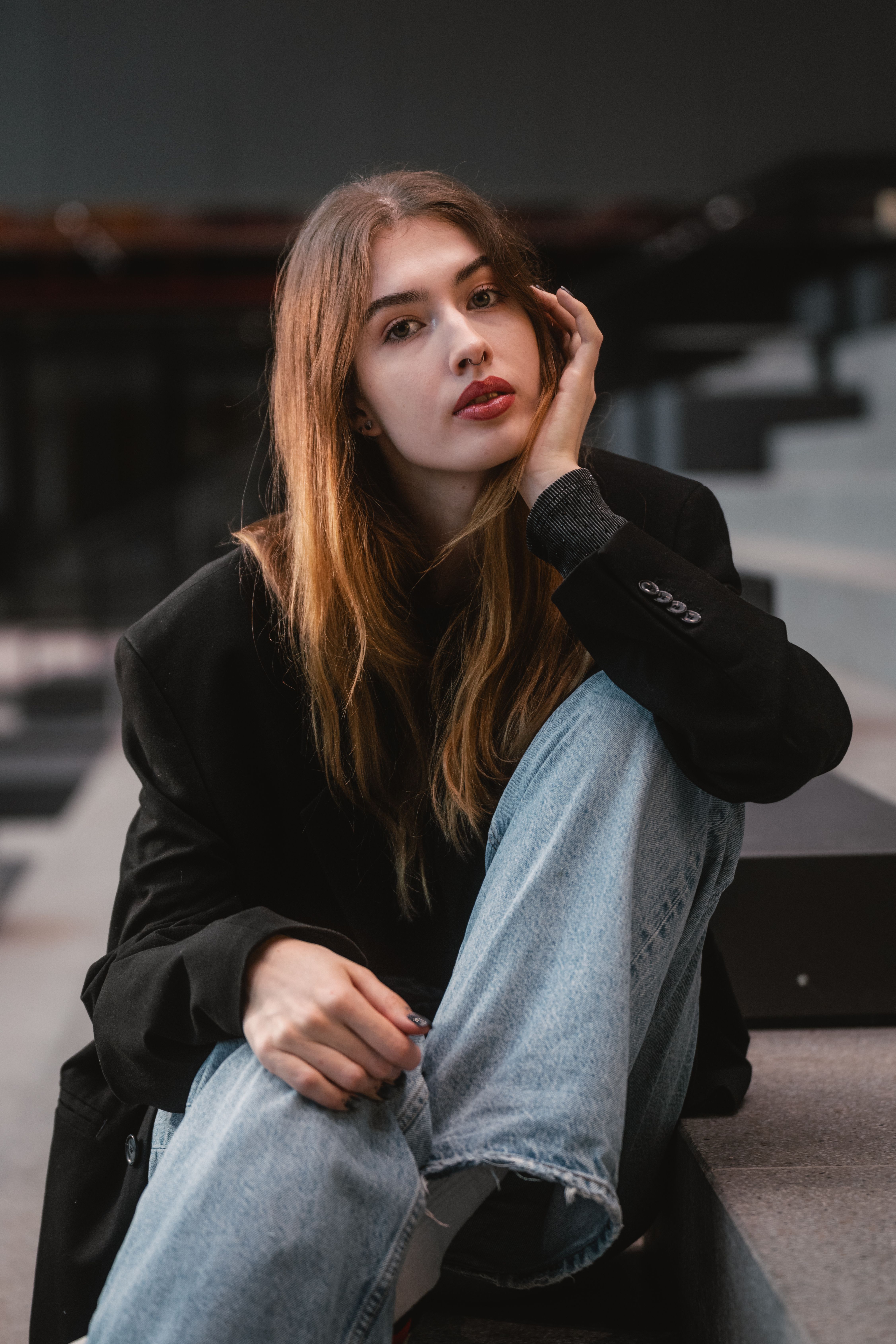 Woman in dark jeans with relaxed blazer