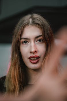 A candid close-up of a fashionable woman in Vienna, showcasing modern street style.