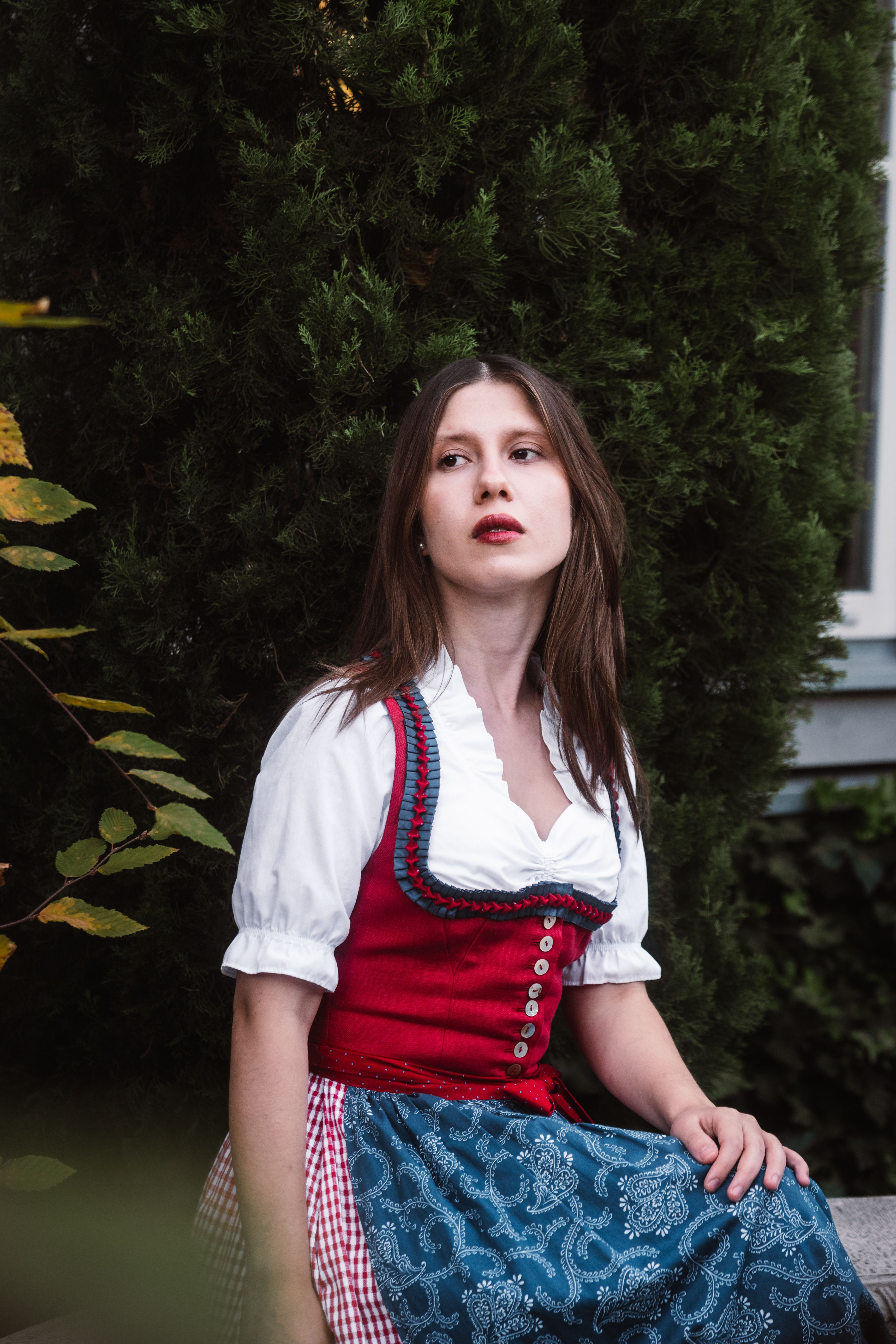 Traditional Austrian Outfit in a Serene Setting · Free Stock Photo