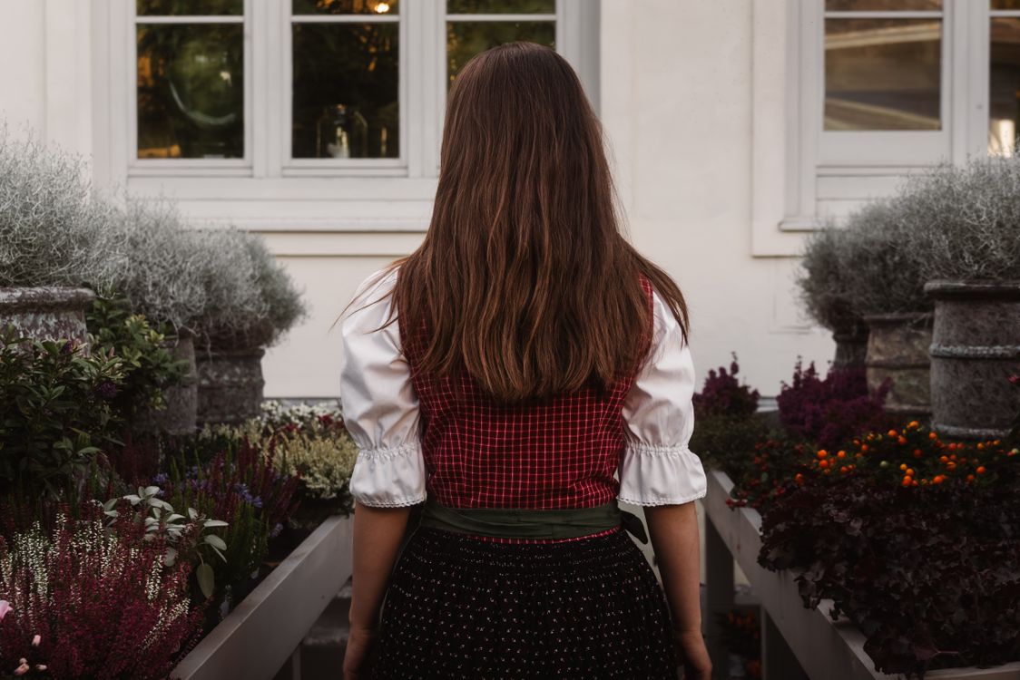 Back View of Woman in Traditional Austrian Dress · Free Stock Photo