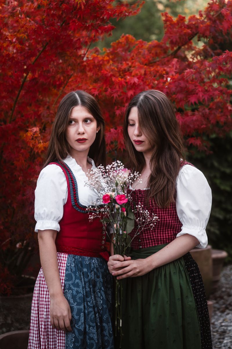 Austrian Women in Traditional Dress with Flowers · Free Stock Photo