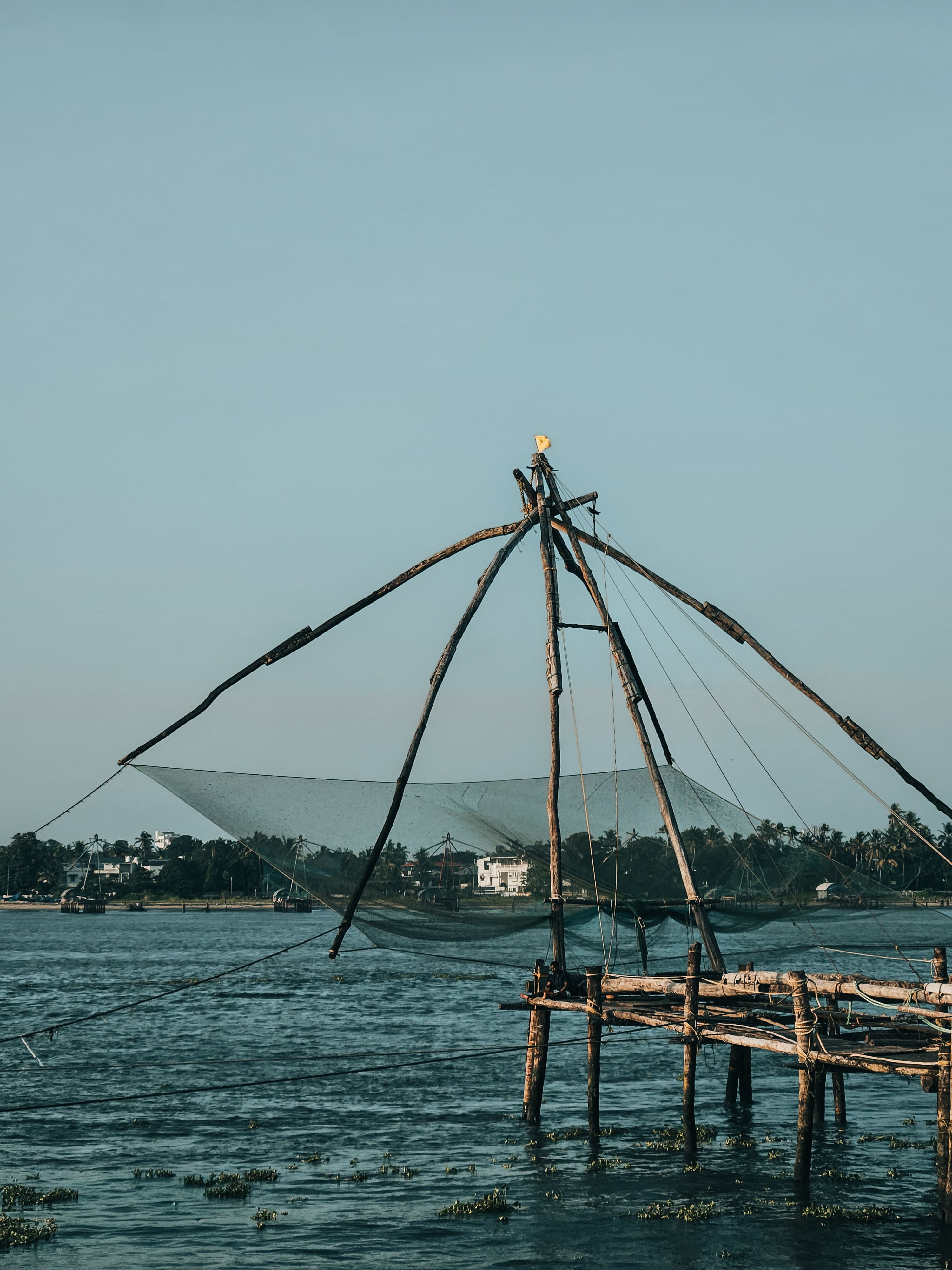 Traditional Chinese Fishing Net in Serene Waterscape · Free Stock Photo