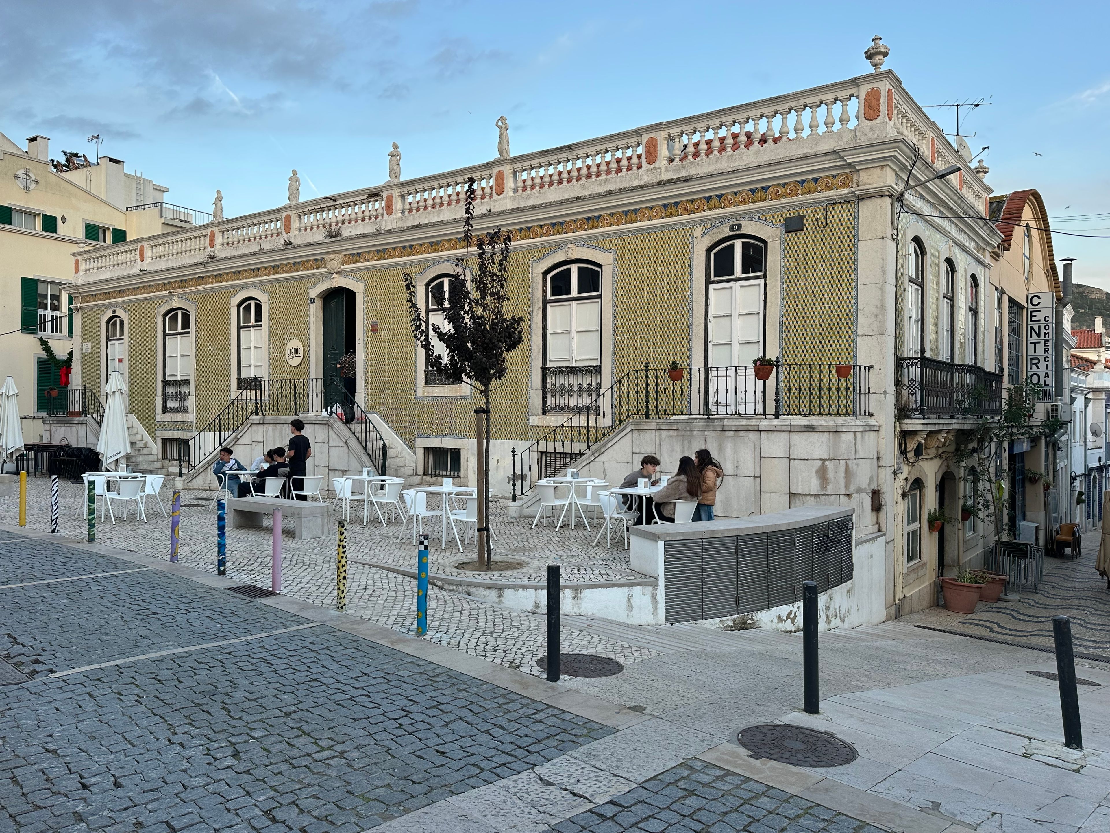 Ground-floor coworking café at a digital-nomad coliving in Cais do Sodré, Lisbon