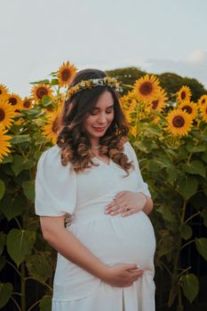 Expectant mother in a sunflower field, embracing nature and tranquility.