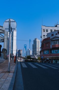 Urban street view featuring modern skyscrapers on a clear day.