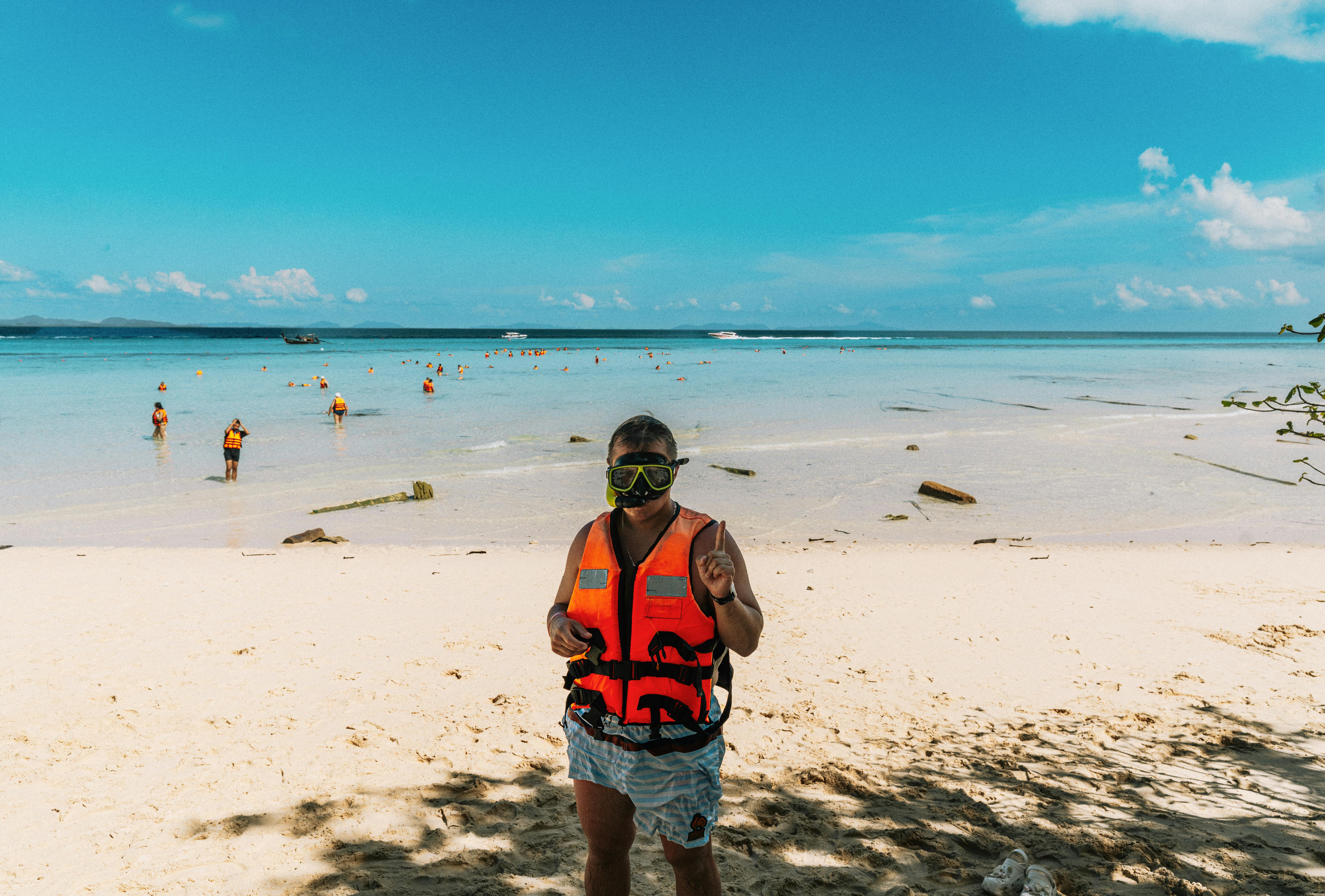 Snorkeler on sunny Thailand beach near Similan Islands