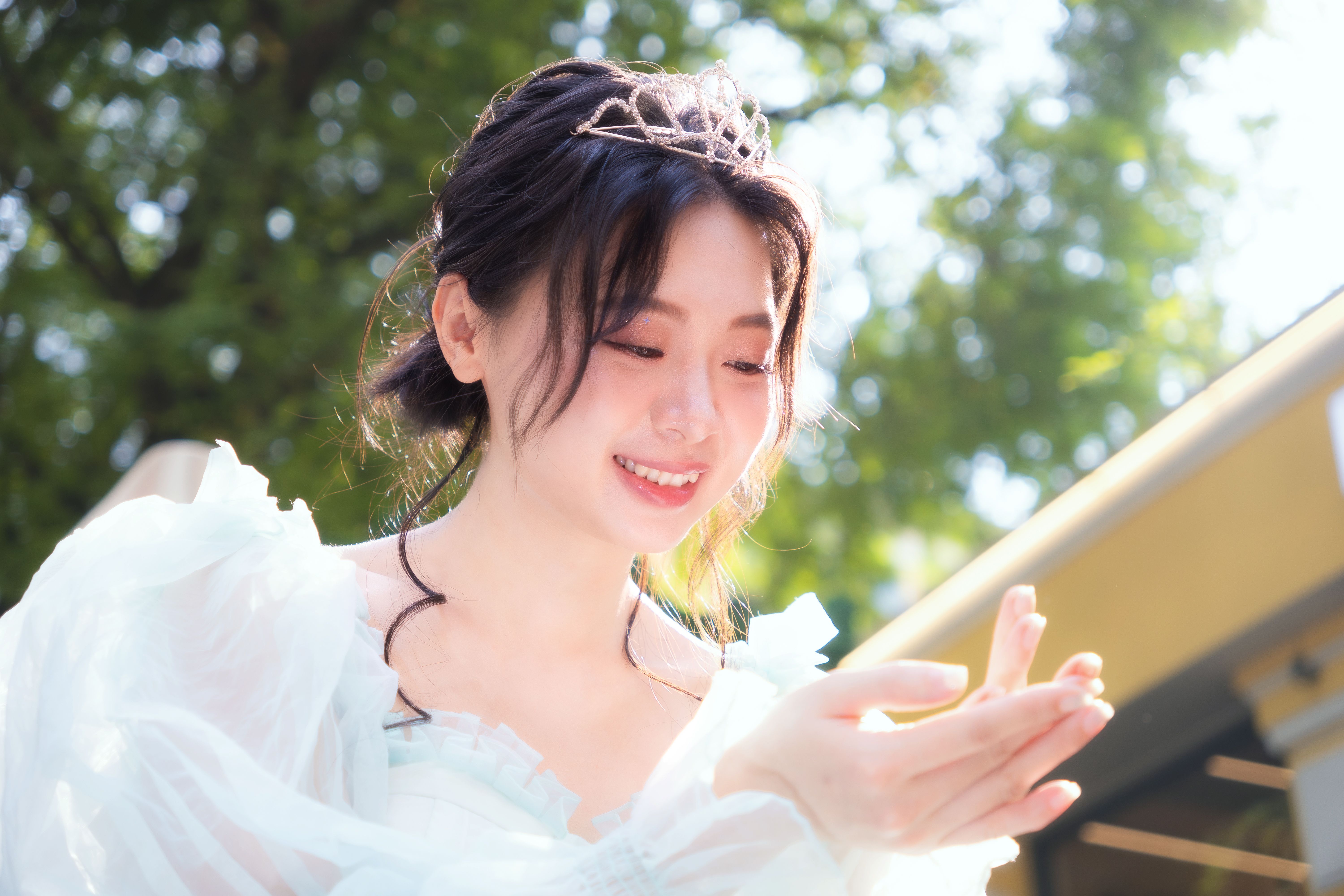 Elegant Asian Woman in Flowing Dress with Tiara · Free Stock Photo