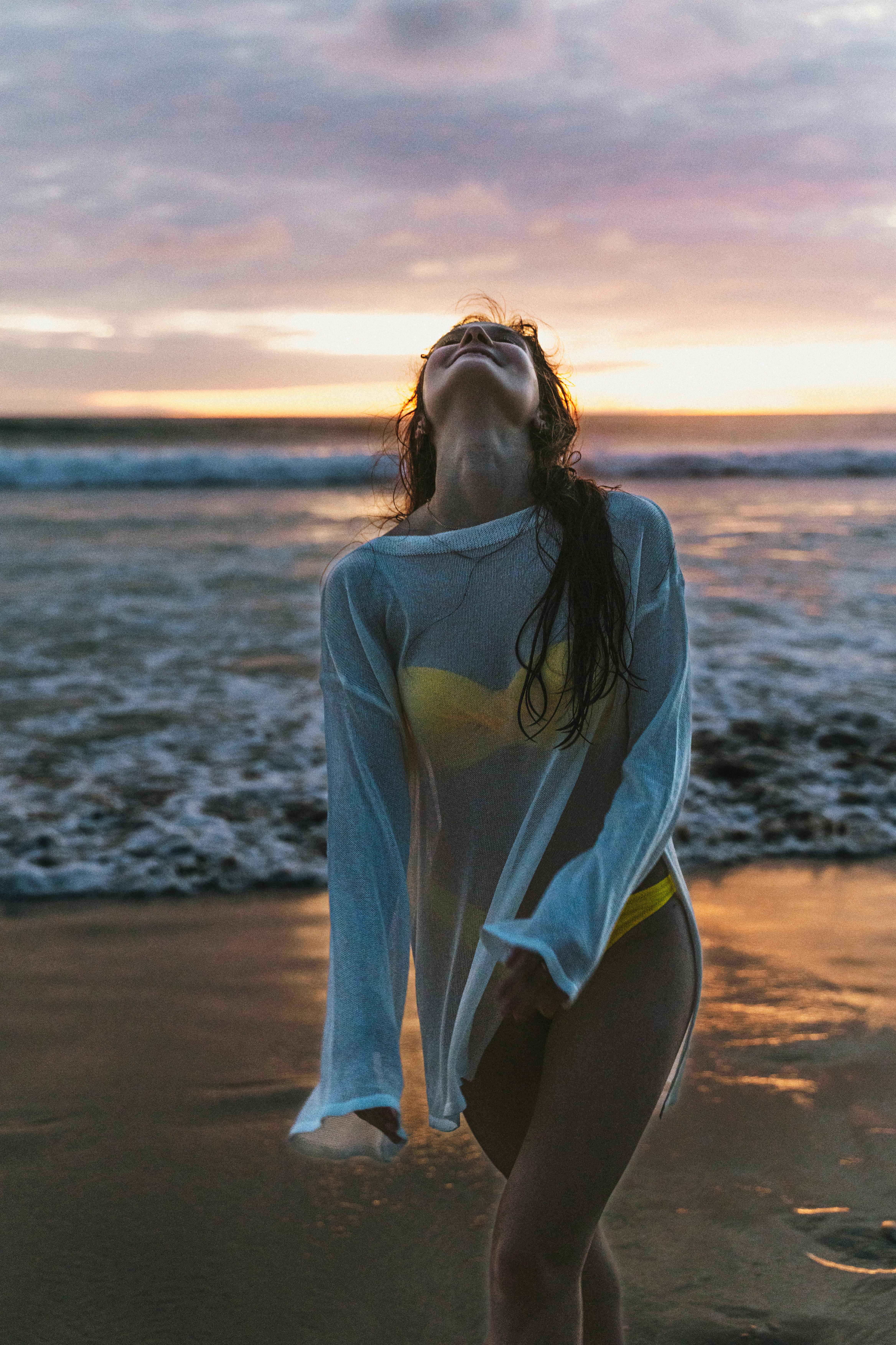 woman enjoying sunset at phuket beach