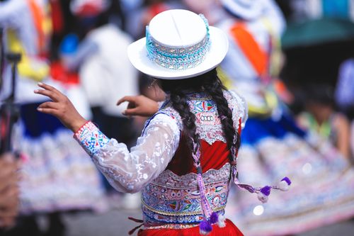 Free Vibrant Peruvian dancer in traditional costume celebrating a festival in Arequipa, Peru. Stock Photo