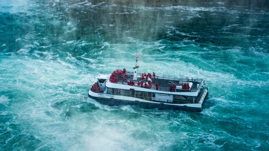 Hornblower Niagara Cruises boat approaching Niagara Falls, Canada