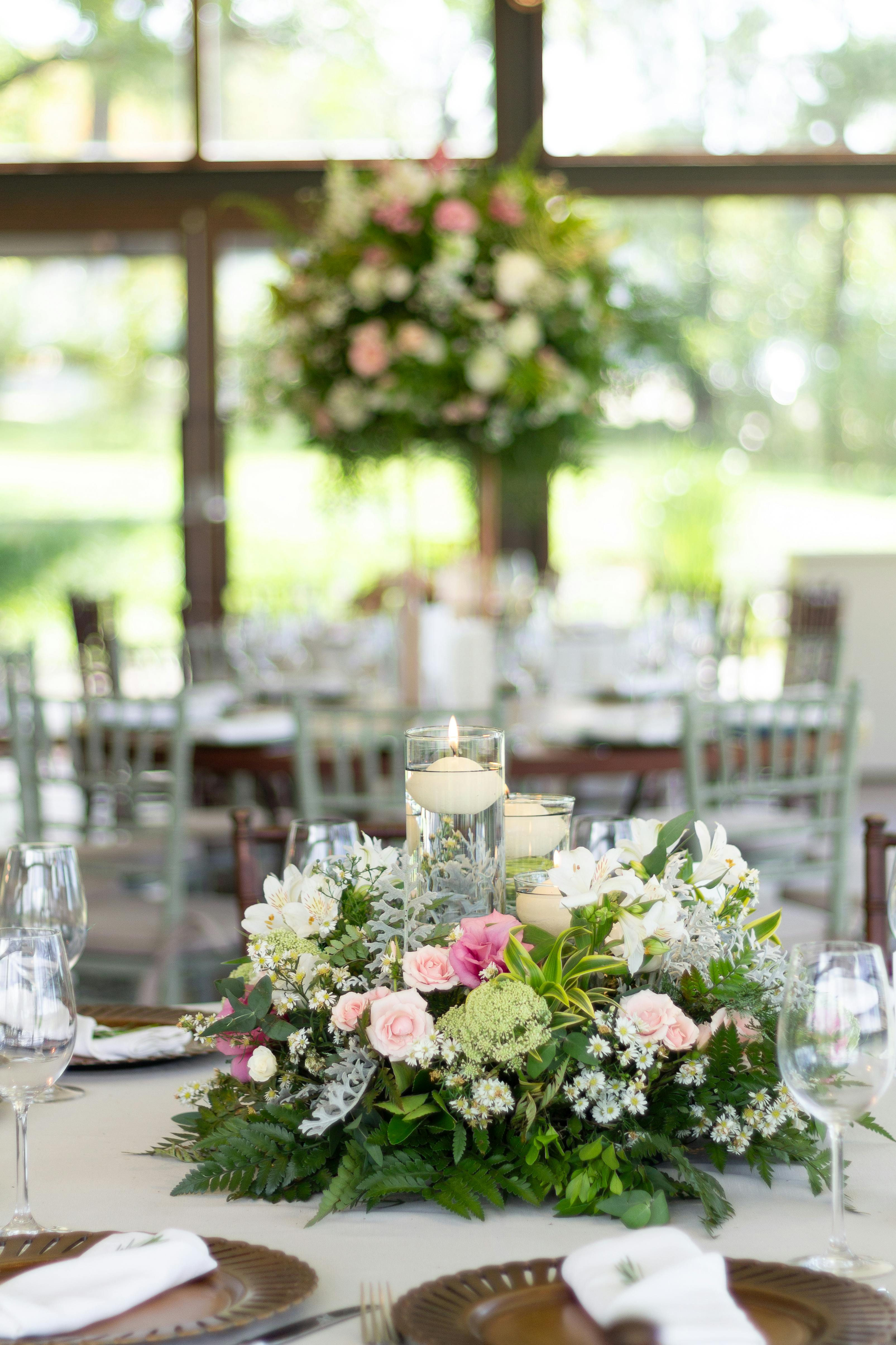 Stunning floral centerpiece and candles at a wedding in São Paulo, Brazil.